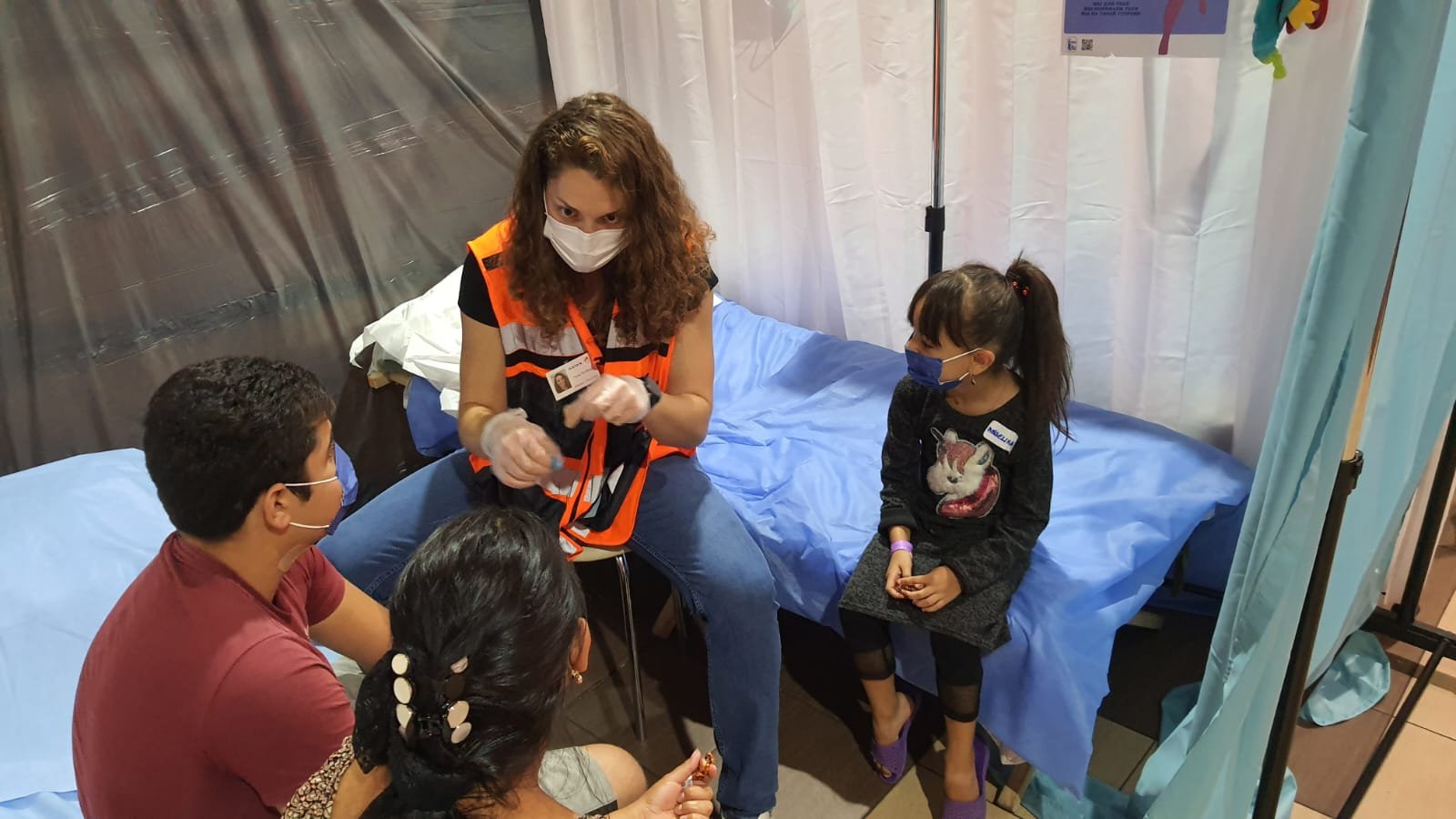 Medic Anna Tsviling treating a family
