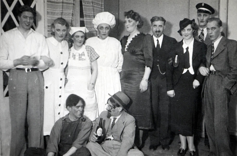 Hulda Karen, standing second from the left, as her character in a play