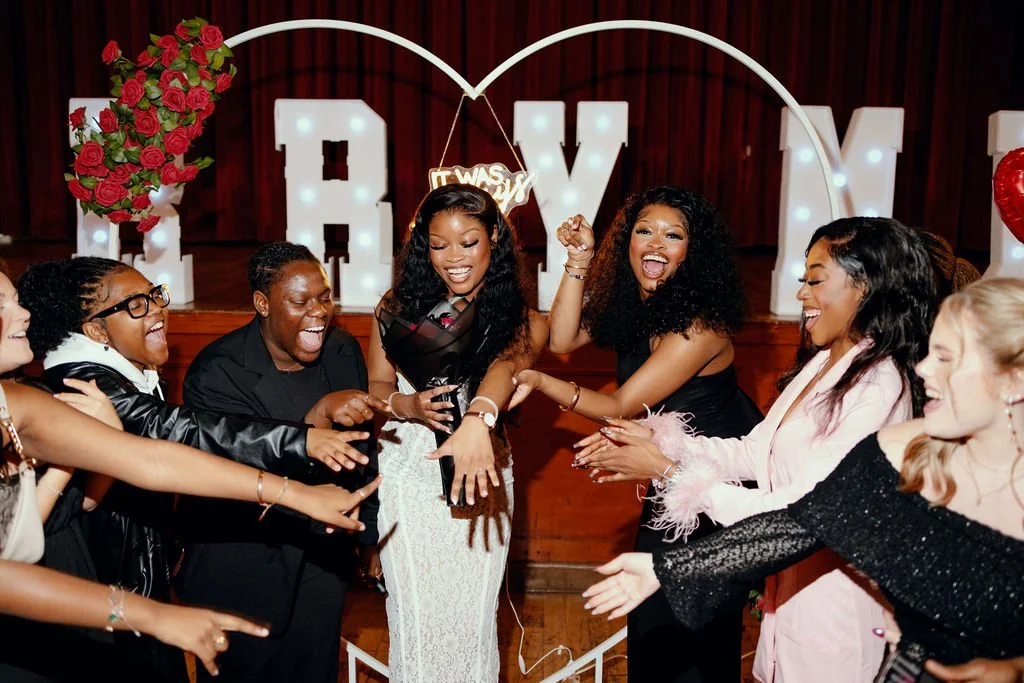 Surprise marriage proposal photography of a Nigerian couple in Glasgow, Scotland. Friends are celebrating after the proposal