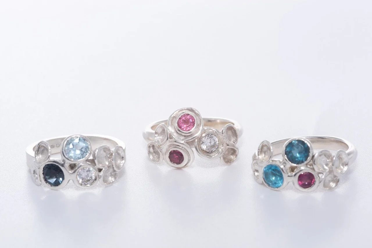 lichen rings stone set pink and blues.jpeg