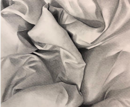 Charcoal drawing of softly draped fabric with realistic folds, highlights, and shadows, demonstrating careful observation of light, texture, and form.