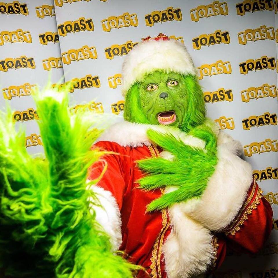 Grinch impersonator at event