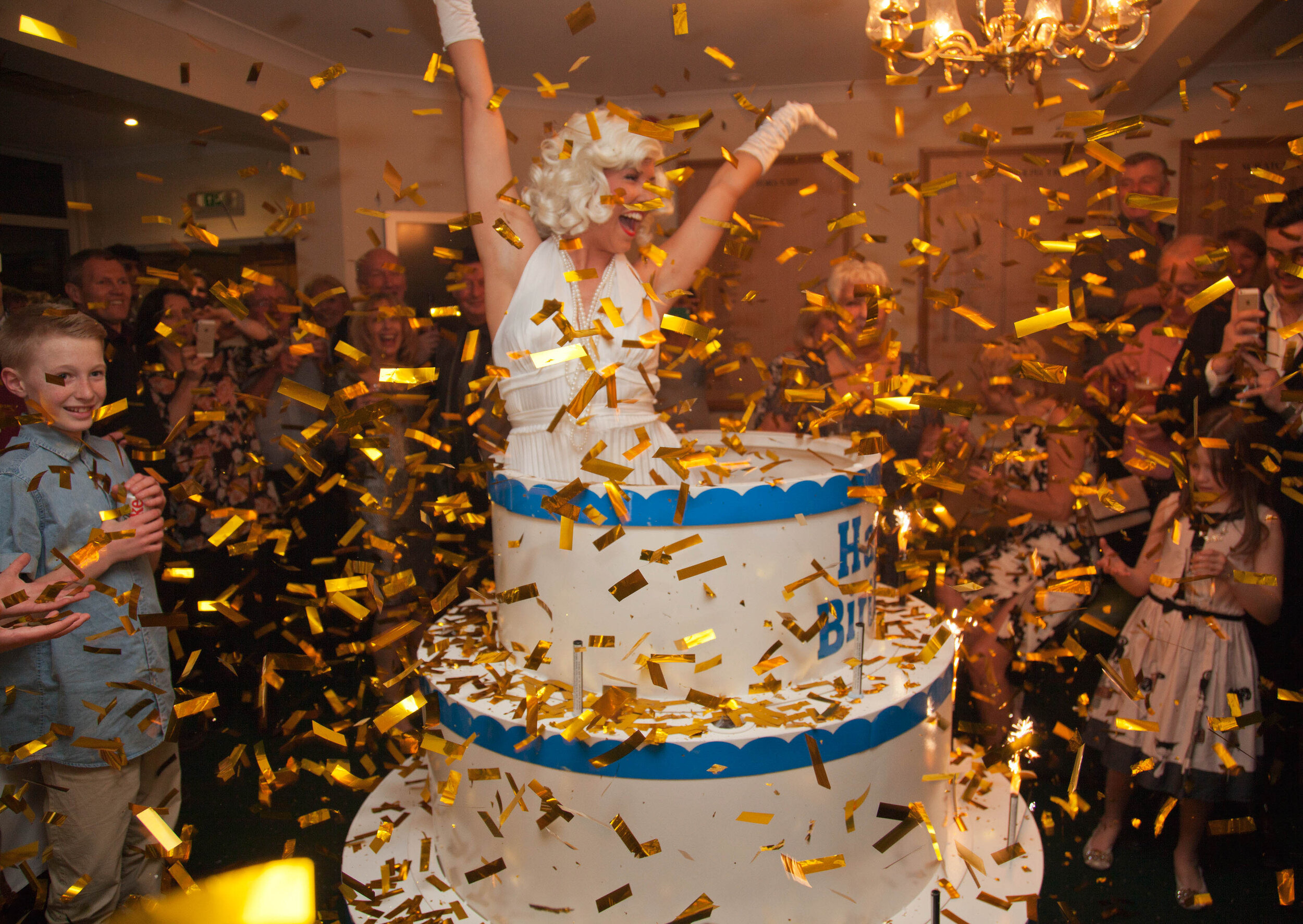 Pop-out cake girls at event