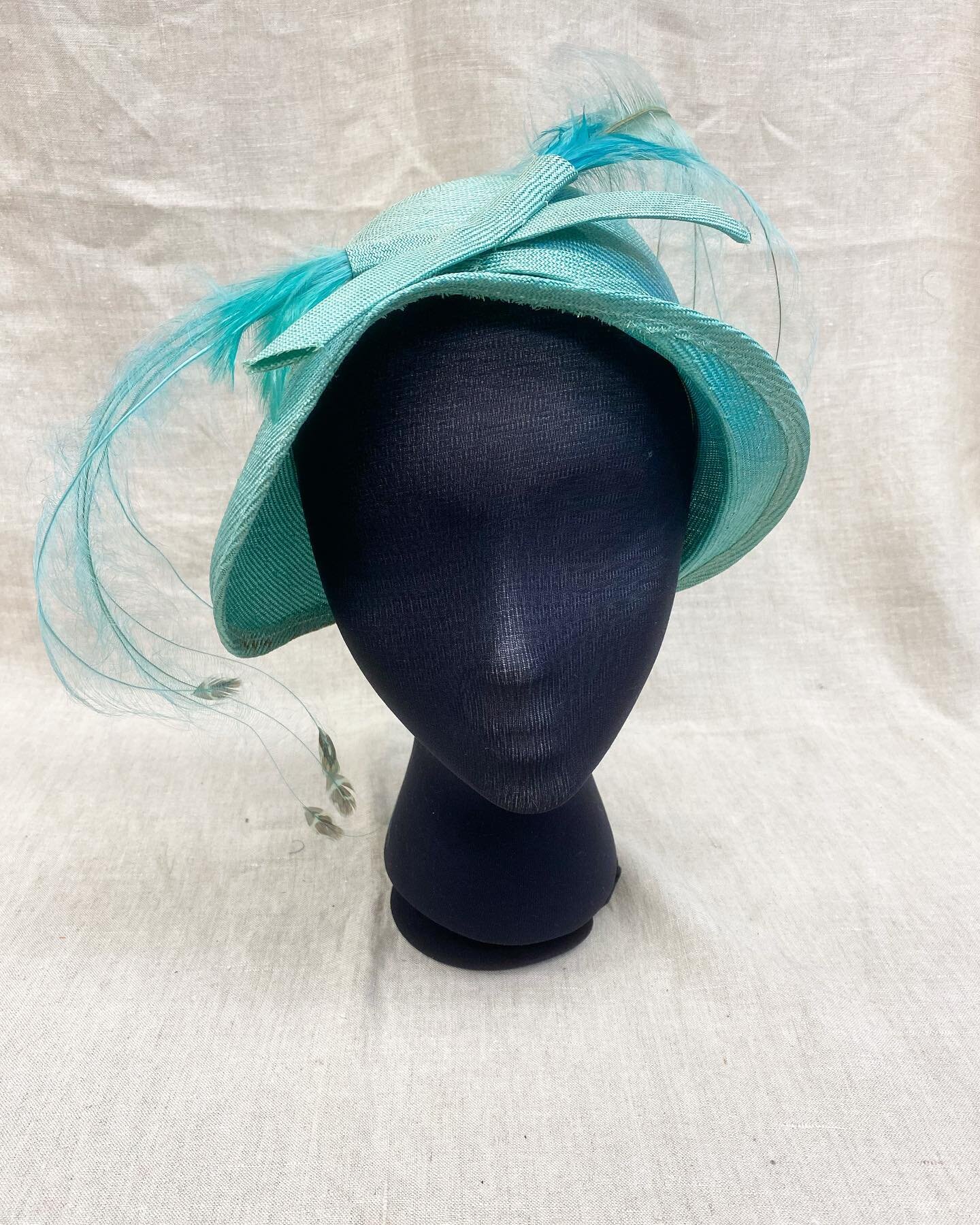 Sometimes Mondays come and we get wrapped up in the day instead of focusing on the important things, like HATS. Though our millinery minds were elsewhere yesterday, they are raring to go today! 

This hat is a staff favorite, we love the bright color