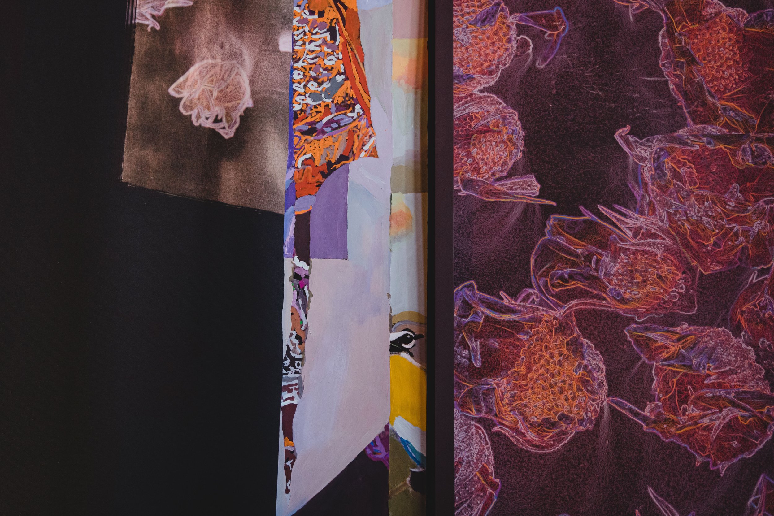 Abstract art installation featuring a variety of colorful patterns, shapes, and floral motifs on multiple panels.