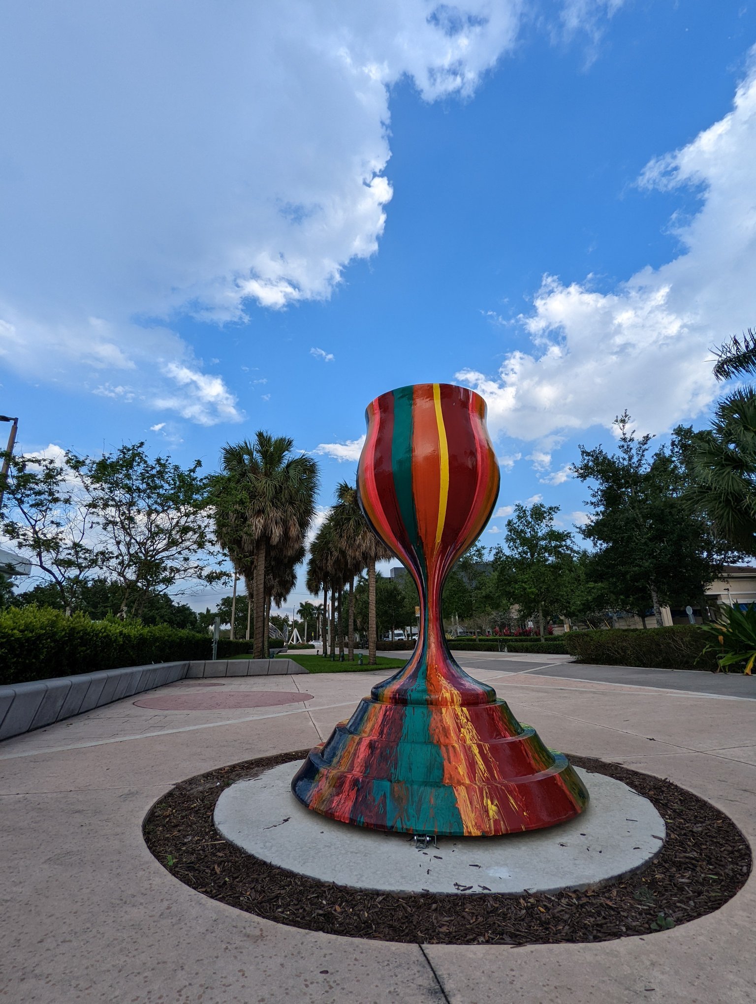 Tradition With a Twist public art menorah by Yitzchok Moully — tall colorful Jewish sculpture in outdoor park setting