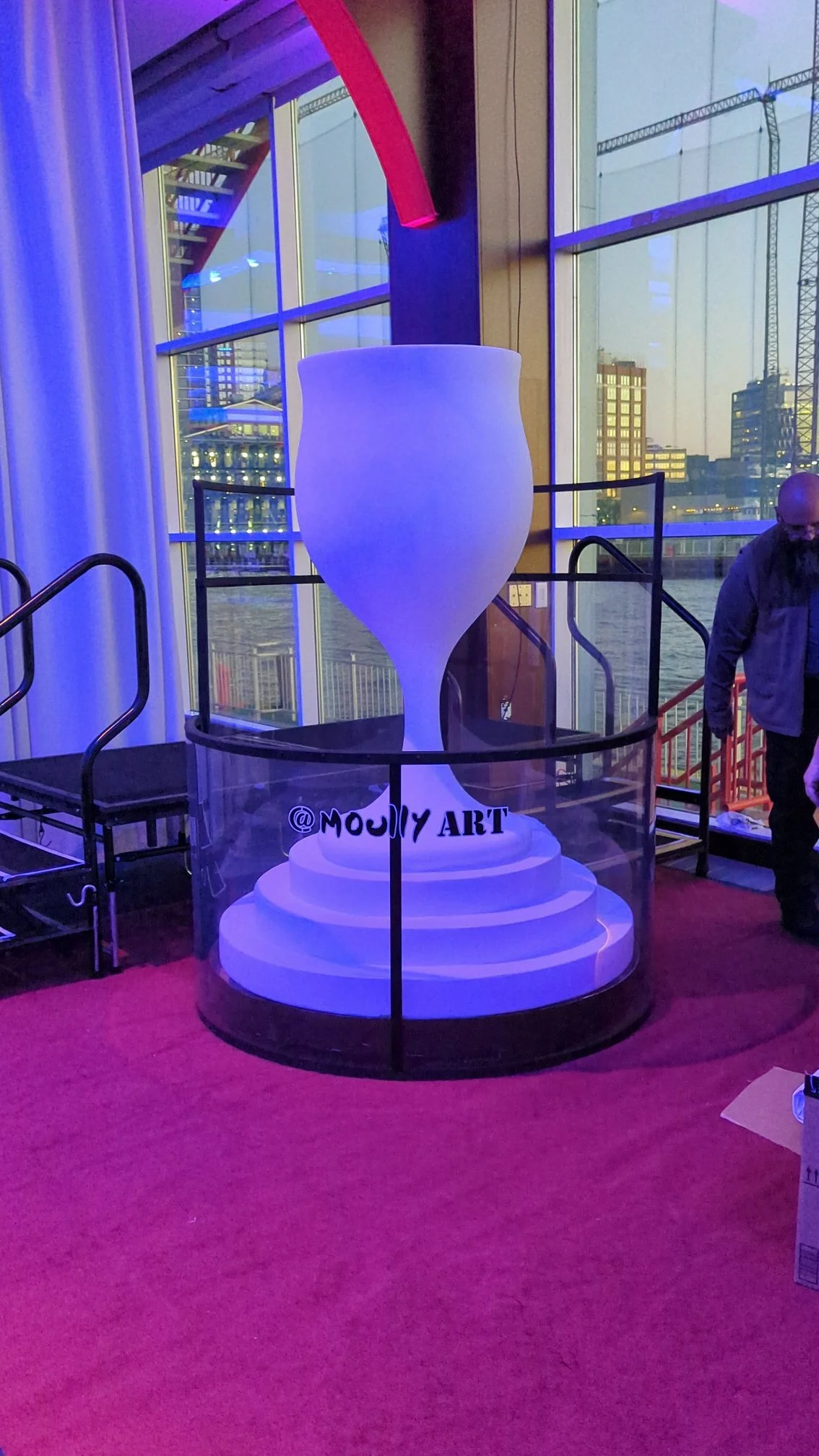 Moully Art vase sculpture by Yitzchok Moully — white Jewish contemporary art installation on pedestal, blue and purple lighting, indoor gallery event