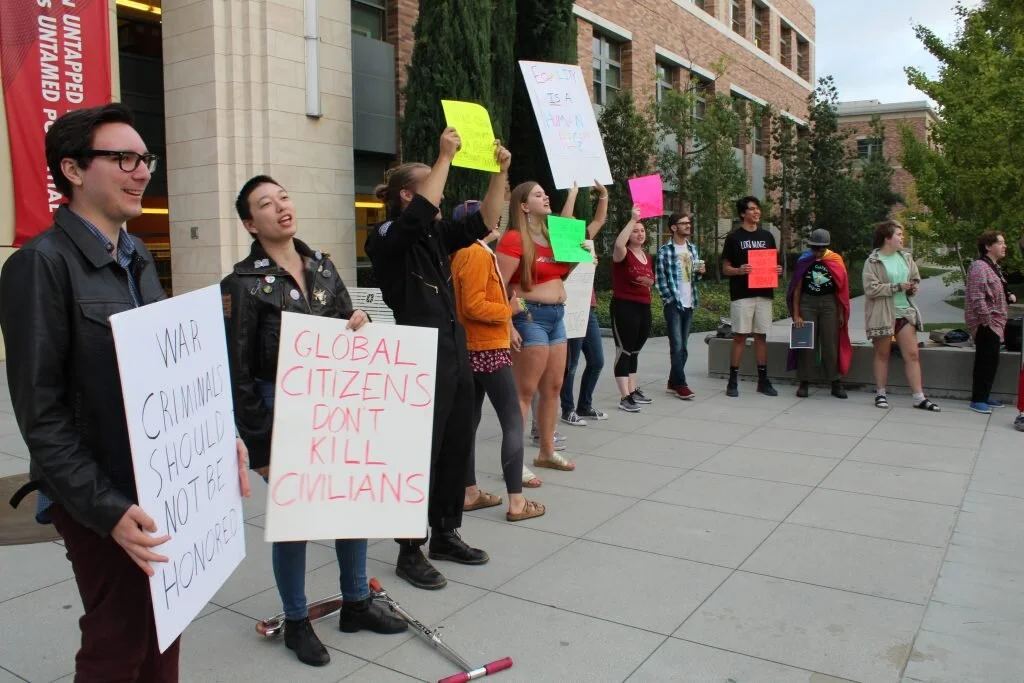 ‘This is not partisan’: Anniversary event met with protest