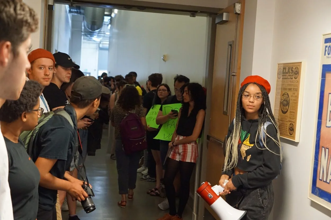 After at least 150 attend protest against hotly debated poster, Dodge faculty set to vote on its removal