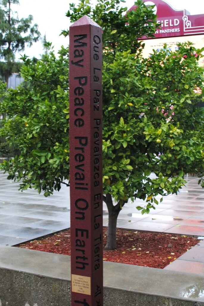 Students, faculty dedicate peace pole near Argyros Forum