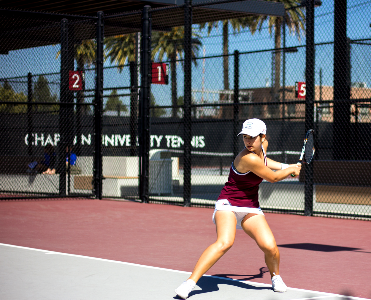 Freshman tennis players causing a racket