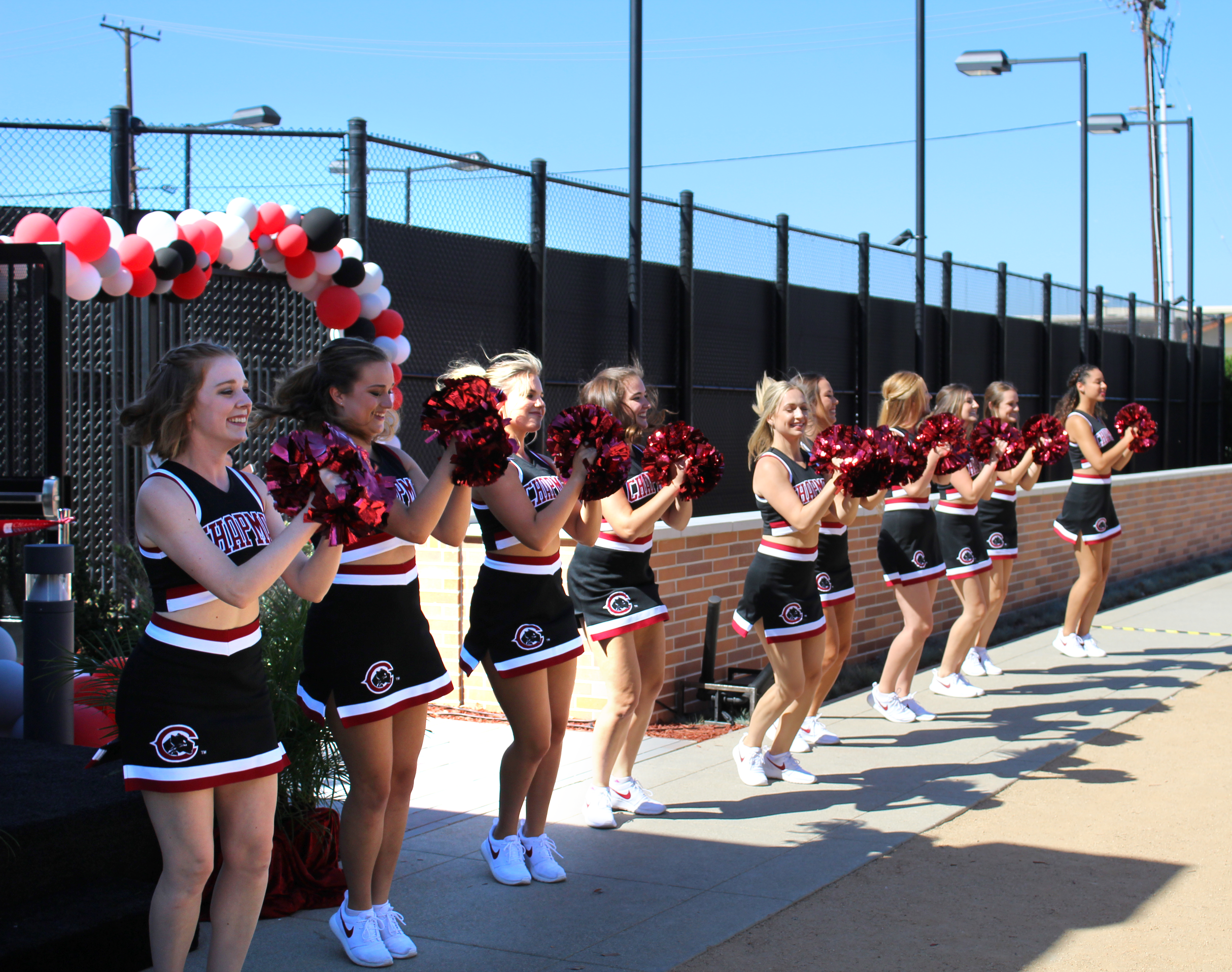 Behind cheer’s pep and pompoms