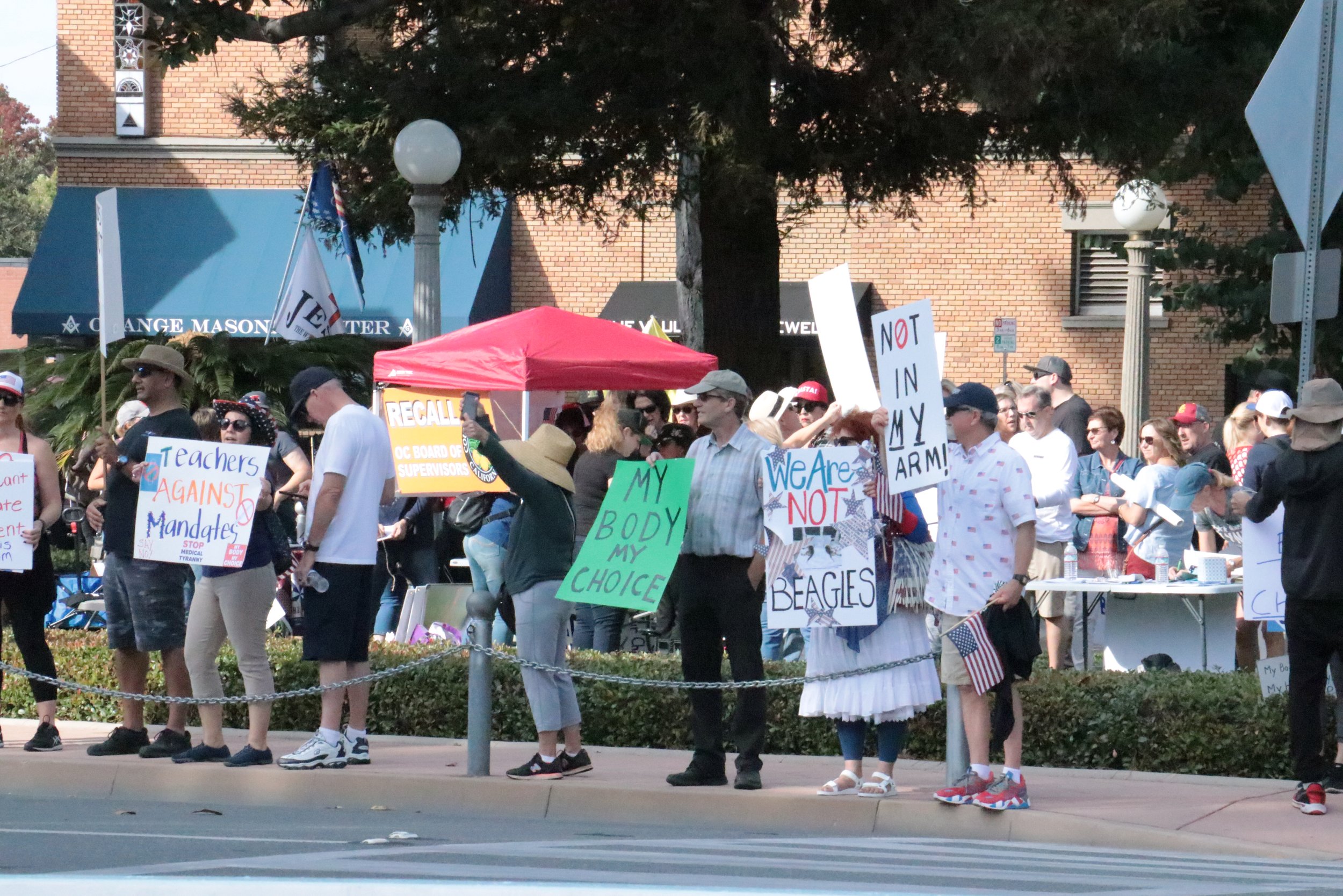Anti-mask, anti-vaccine mandate rally gathers in Orange Plaza Paseo