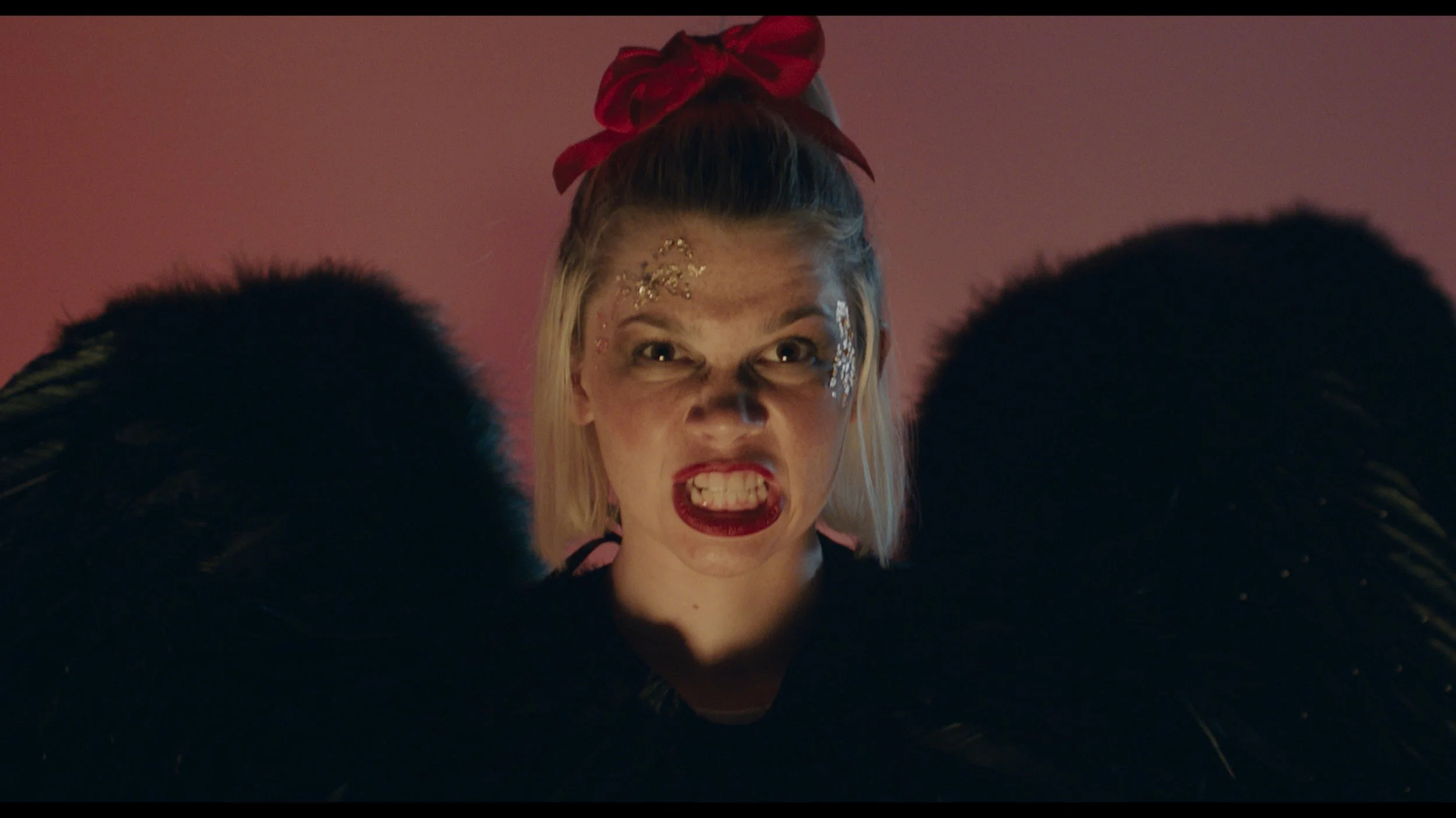  Aside from the cheerleader scenes sprinkled throughout the film, it also contains a segment titled “Medi-Evil” (third picture), directed by Monica Moore-Suriyage. In “Medi-Evil,” the sixth short of the film, women’s bodies are represented in the for