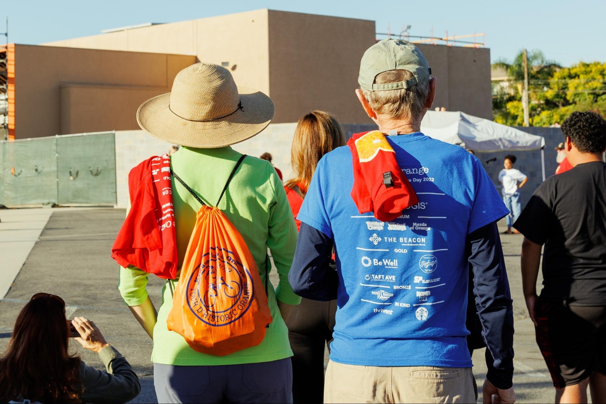   Two volunteers watch the percussive dance number.  