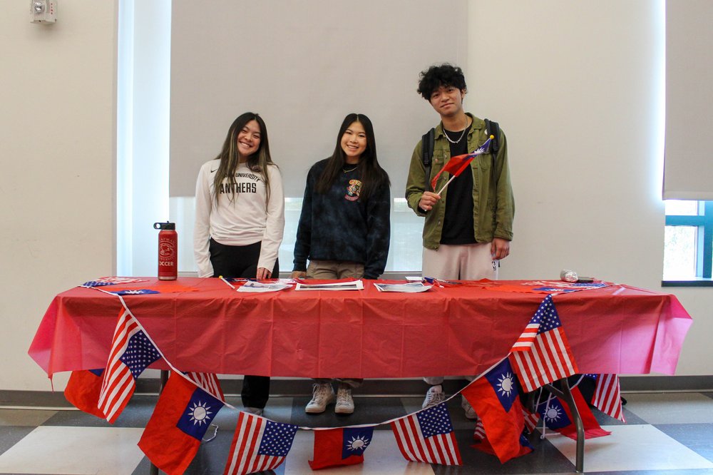    (From left) Sophomore business administration major Jasmine Whittington, senior environmental science and policy and economics double major Lauren Hu and freshman film production major Jimmy Chen table at the event.   