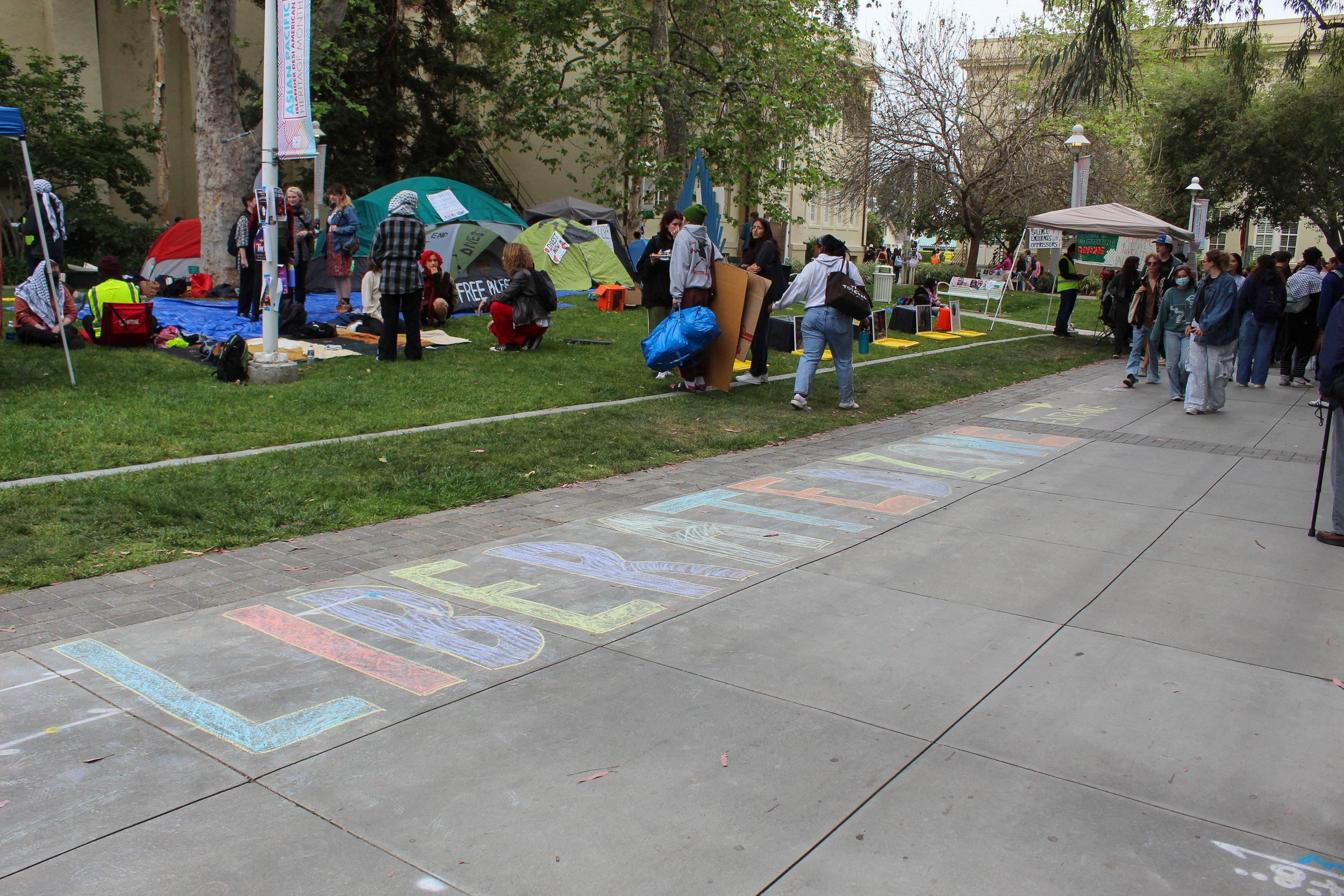    Protestors chalked “Liberated Zone”  in front of the encampment. Photo by RENEE ELEFANTE, Editor-in-Chief   