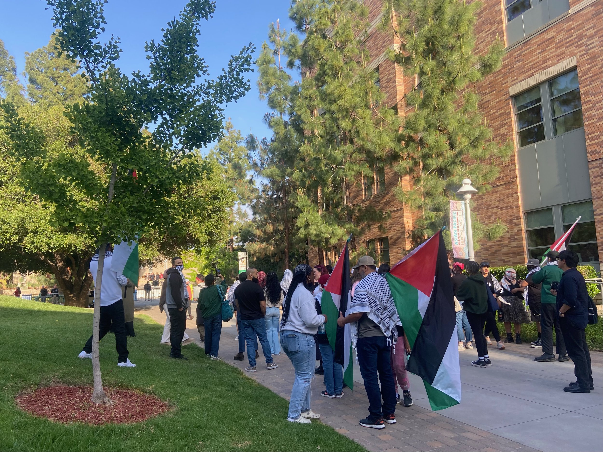    Protestors march with Palestinian flags on May 2. Photo by KIANA KALAHELE, News Editor   