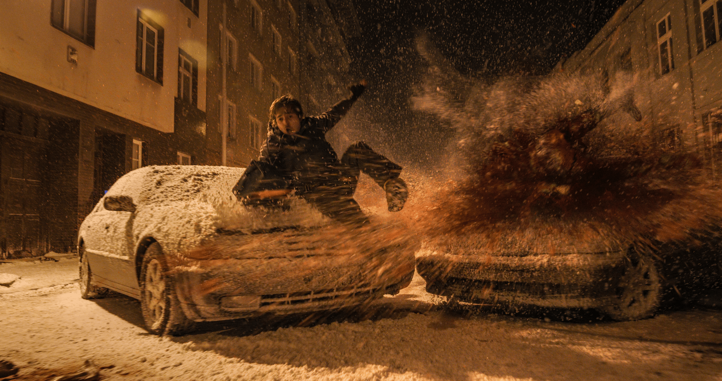 man sliding over car with dust everywhere