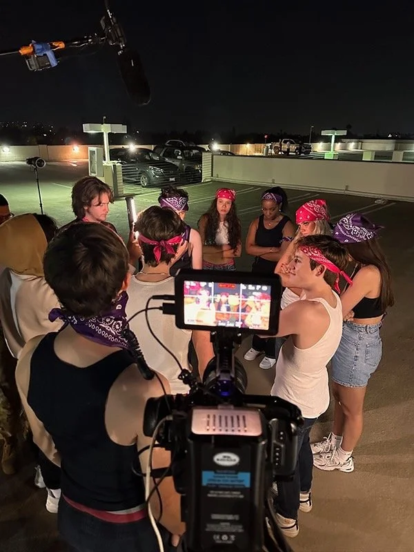 college students in bandanas on top of a parking structure