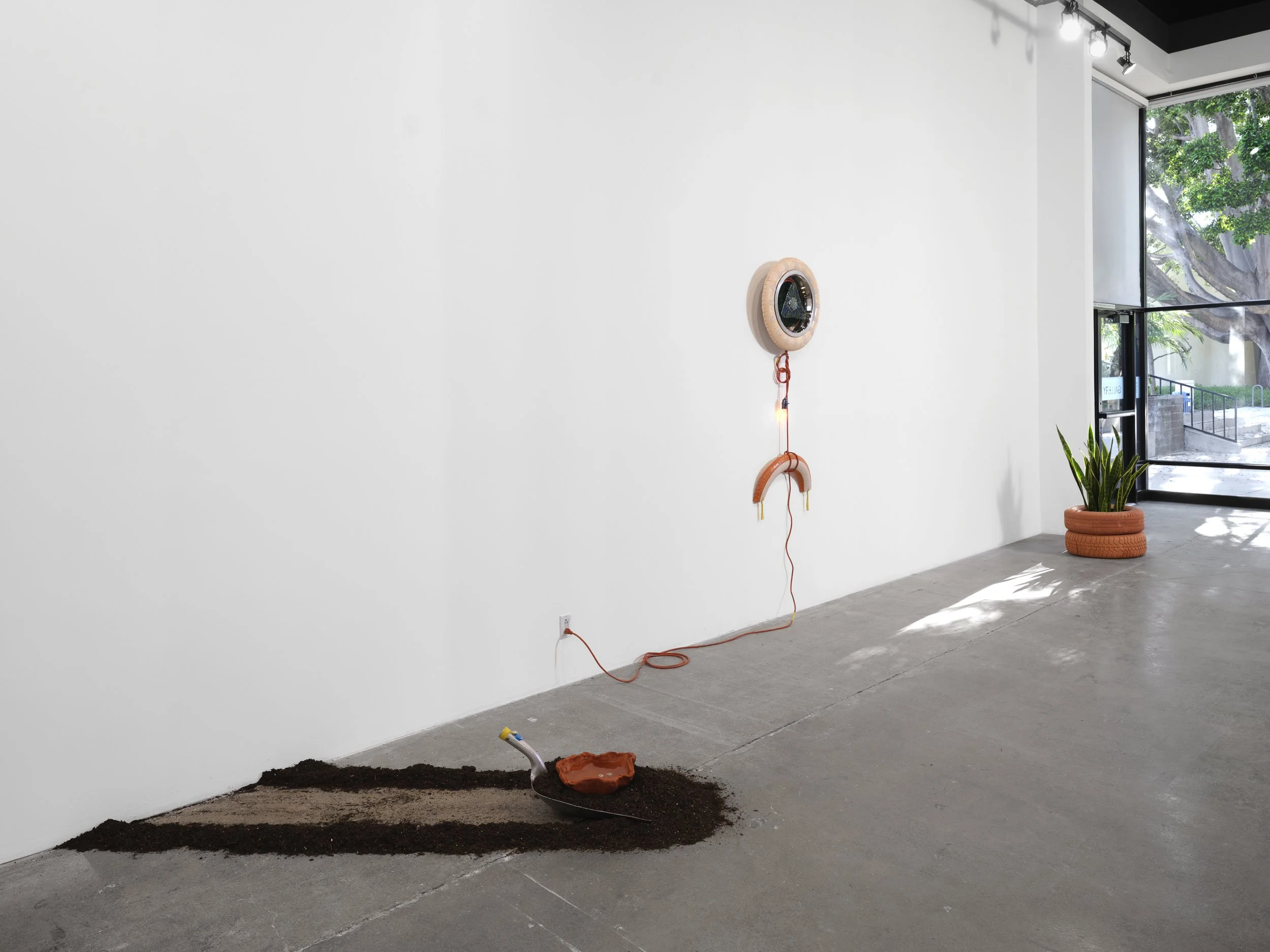 contemporary art piece with a dirt and shovel