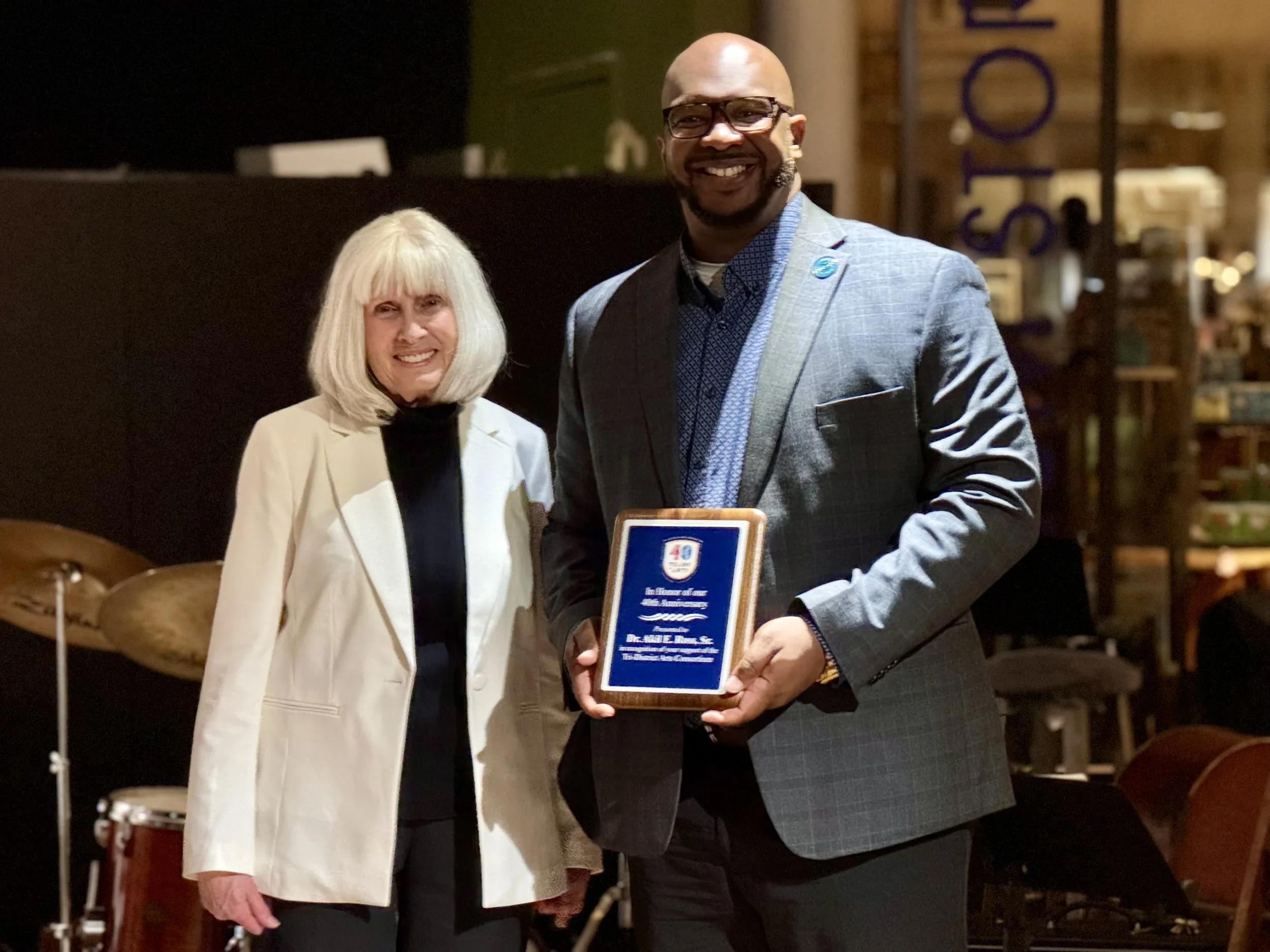 District Five's Superintendent, Dr. Akil E. Ross, Sr. receiving a 40th Tri-DAC Anniversary award in honor of  his support of Tri-DAC.