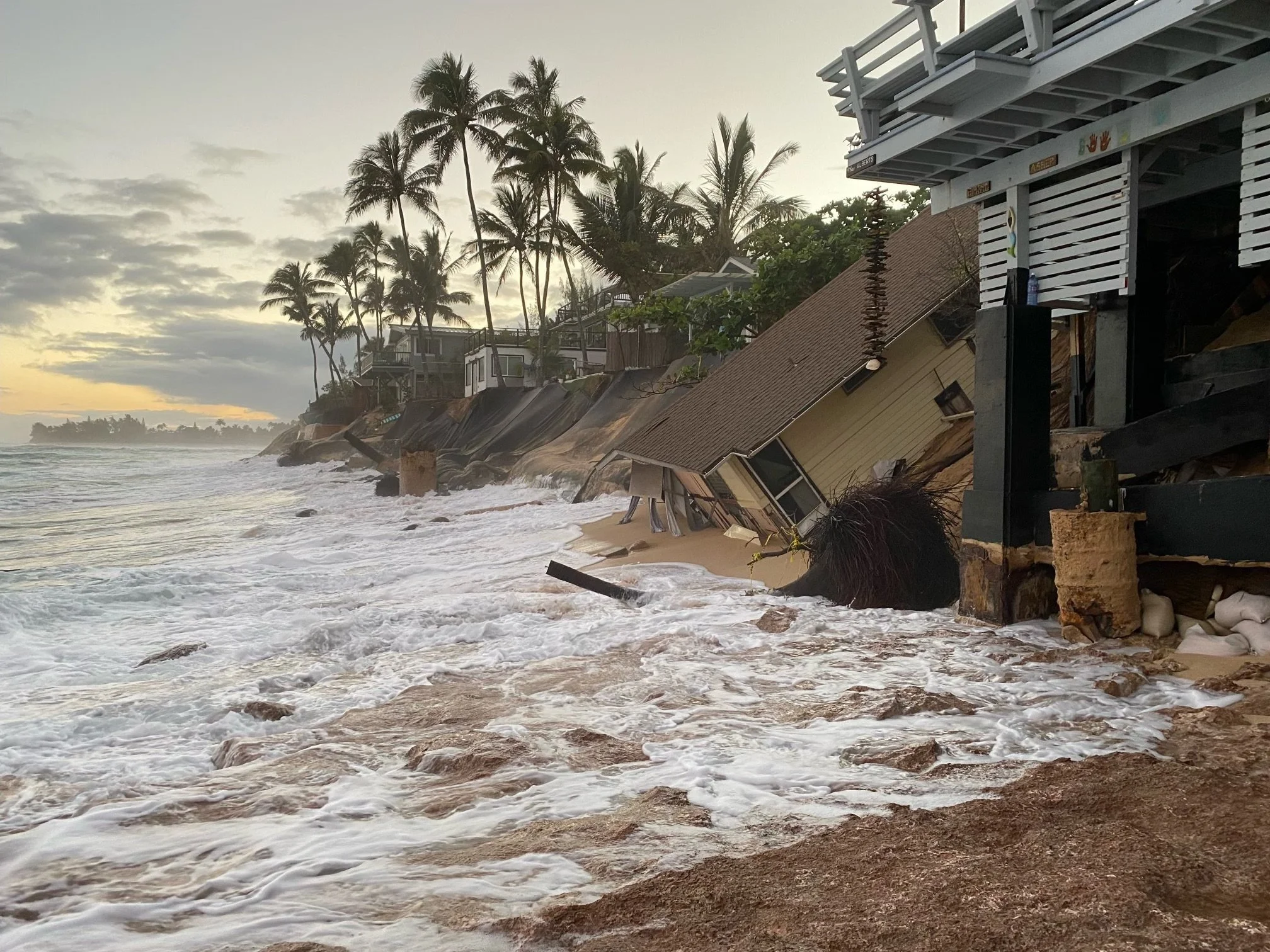 House falls into the ocean.