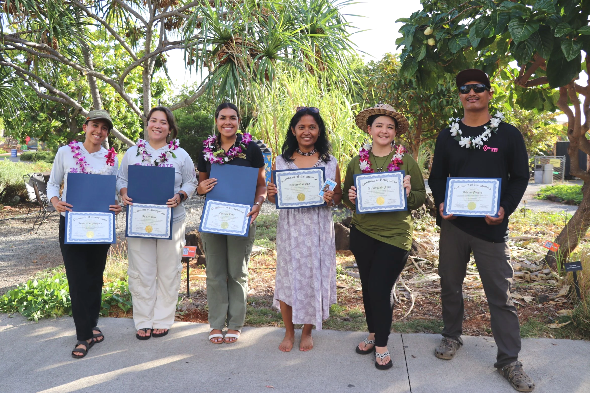 Former Climate Champions holding certificates