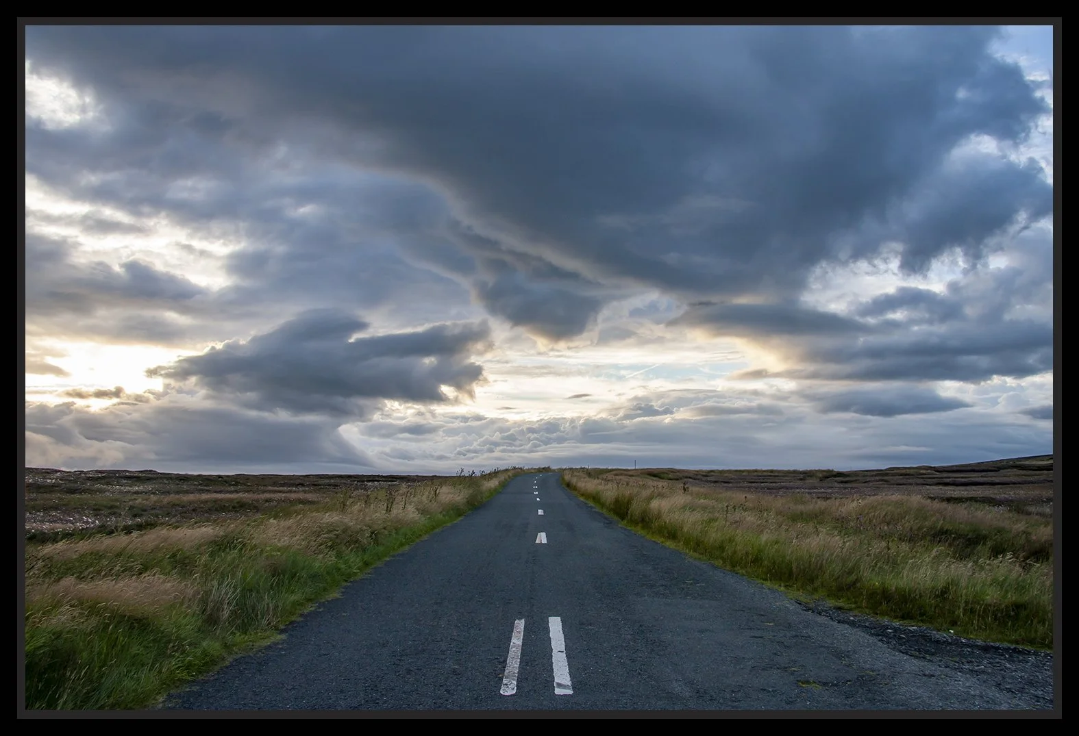 This photograph is printed onto Fine Art paper and then mounted onto Dibond. The Dibond is then mounted into a 'shadow' or 'tray' frame to protect it. There is no glass in this option. It's a very contemporary look. Some of the art currently on the A