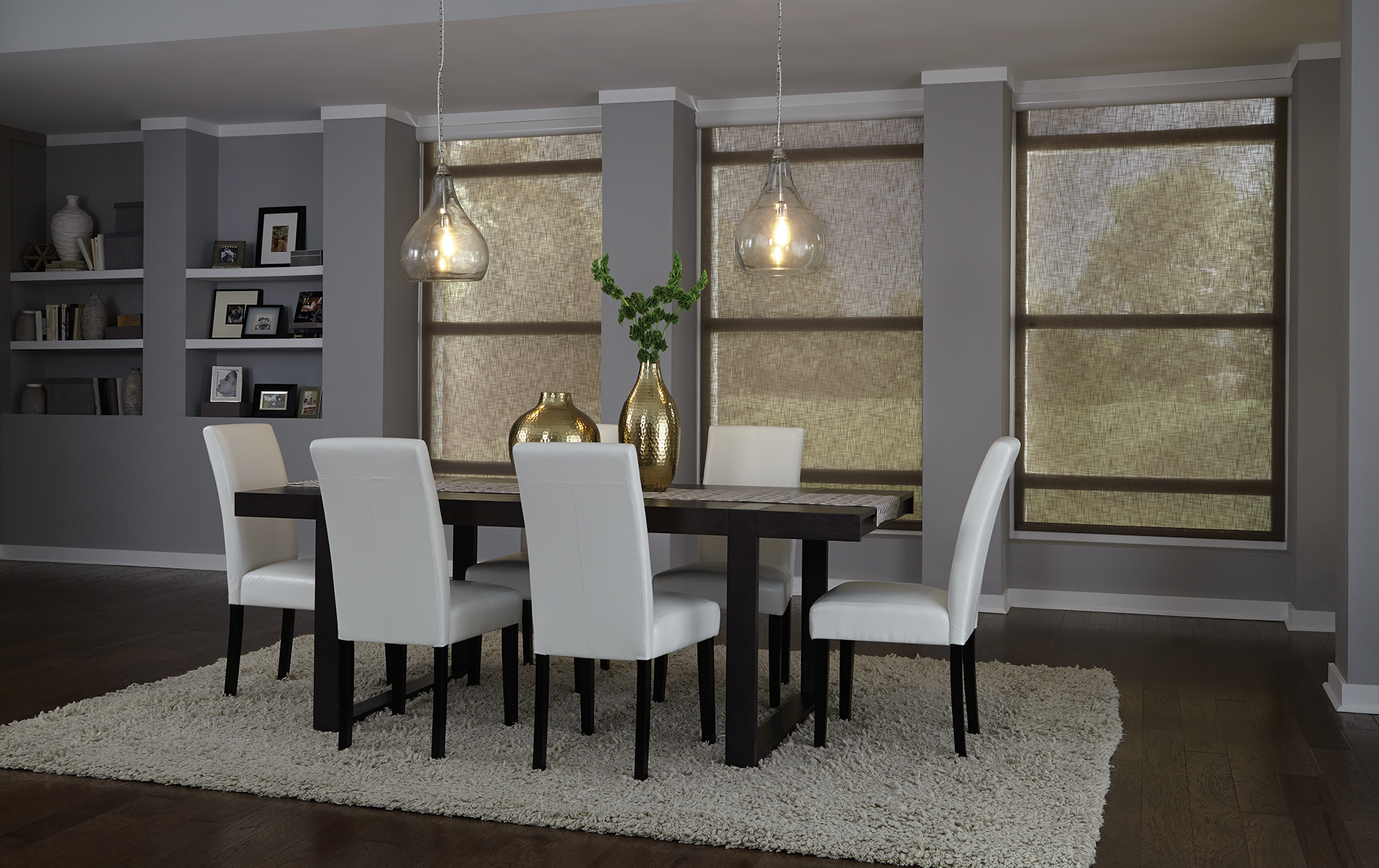 Lutron motorized roller shades in translucent solar fabric filtering afternoon light in elegant dining room VIP Smart Homes installation