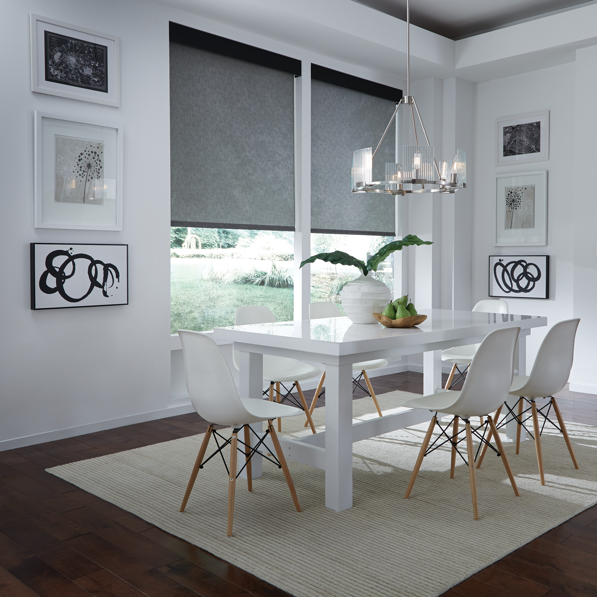 Lutron motorized roller shades in dark gray blackout fabric with aligned dual shades in modern dining room