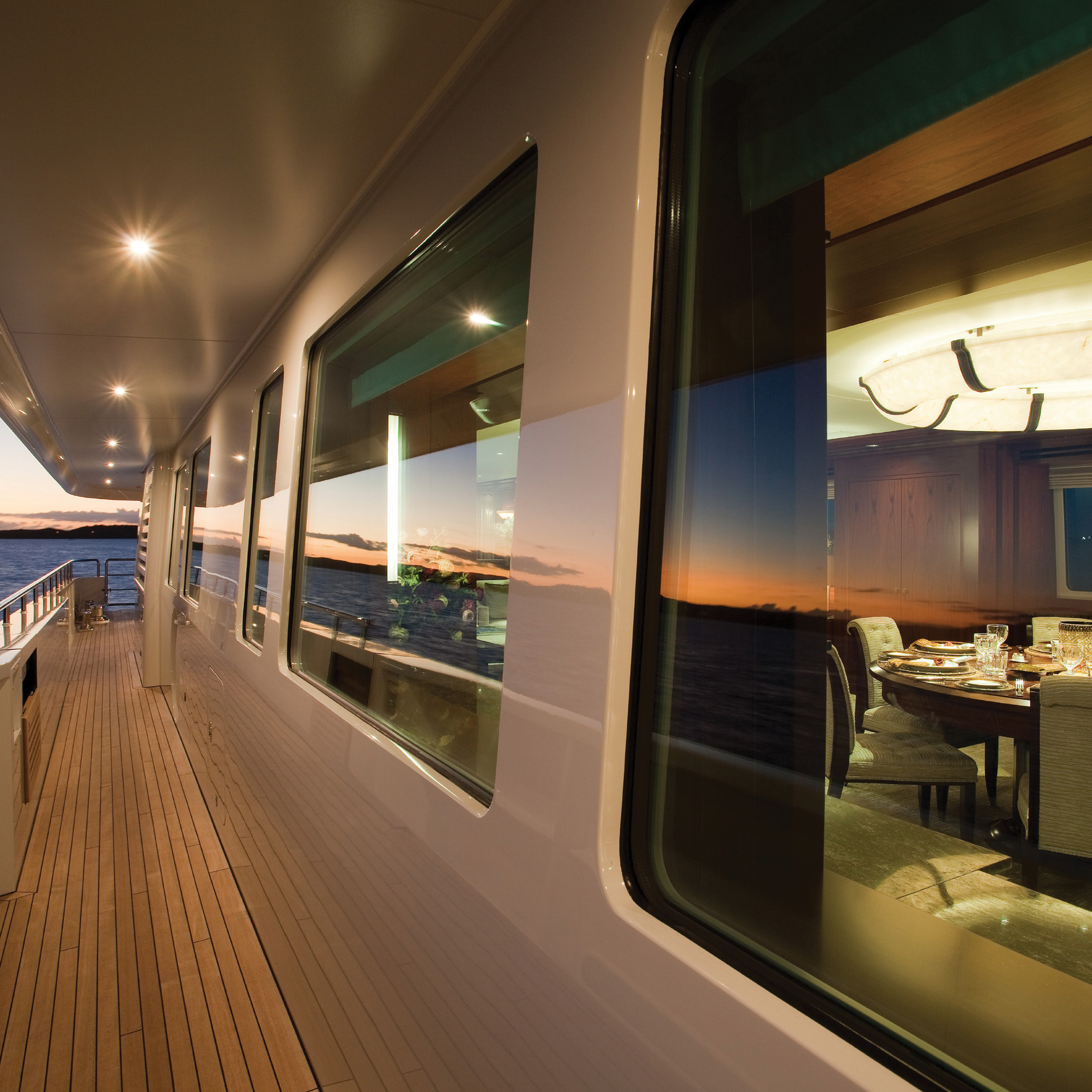 Lutron Ketra lighting installed on mega-yacht deck and dining salon at sunset VIP Smart Homes marine installation