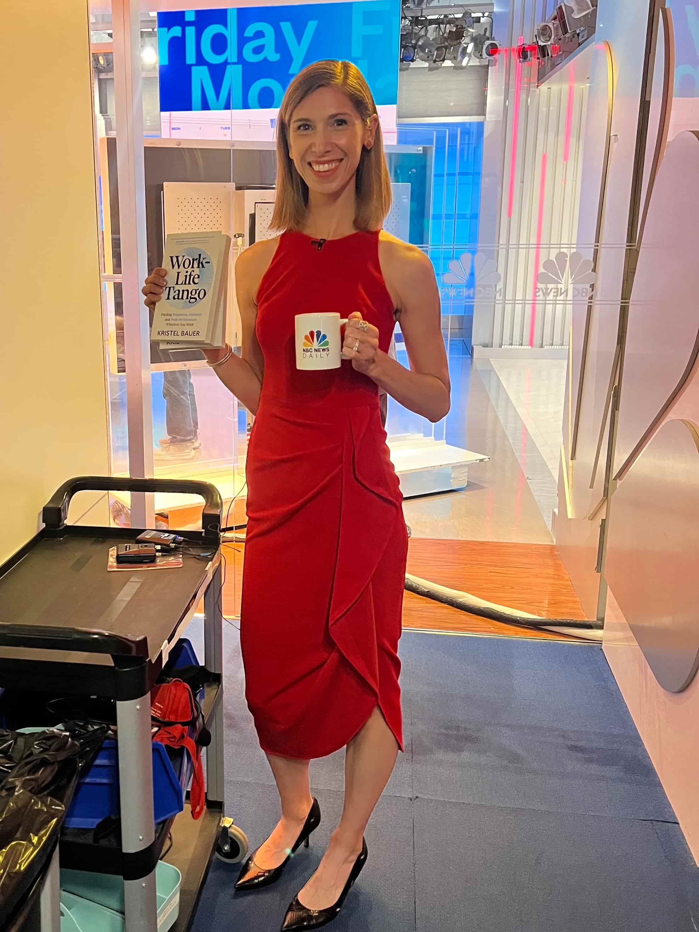 Author and Keynote Speaker, Kristel Bauer, in a NBC News Daily TV Studio holding her book Work-Life Tango