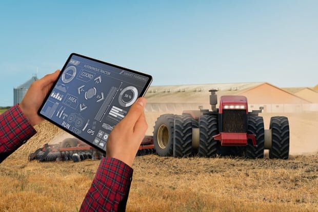 Future farming … an autonomous tractor controlled by tablet. Photograph: Scharfsinn/Alamy