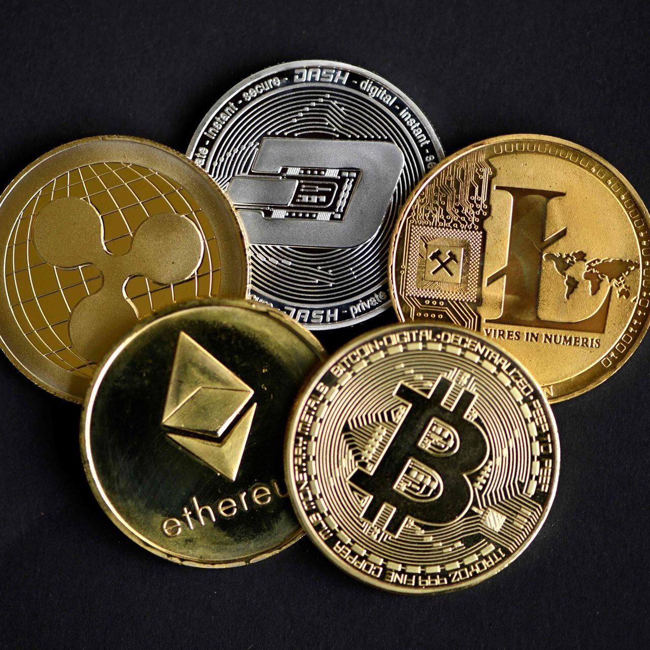 Several symbolic representations of crypto-currencies.