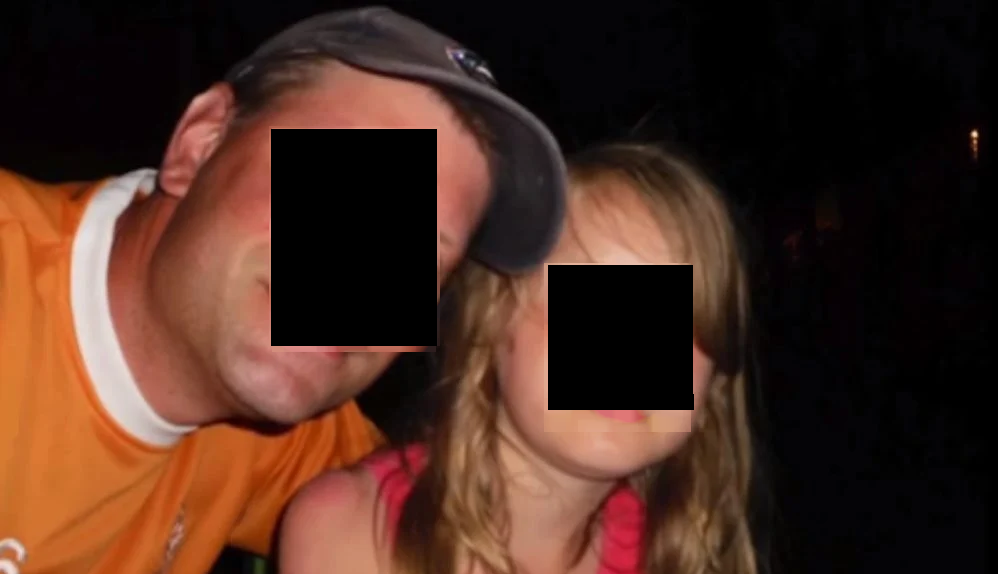 An identity obscured now almost ghostly photo of CD with his daughter, who today has the appearance of a boy.