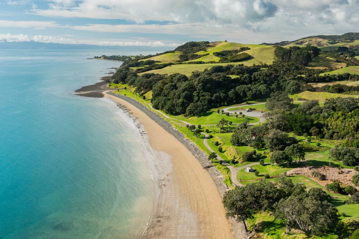 stunning arial view of the beach at tāpapakanga regional park