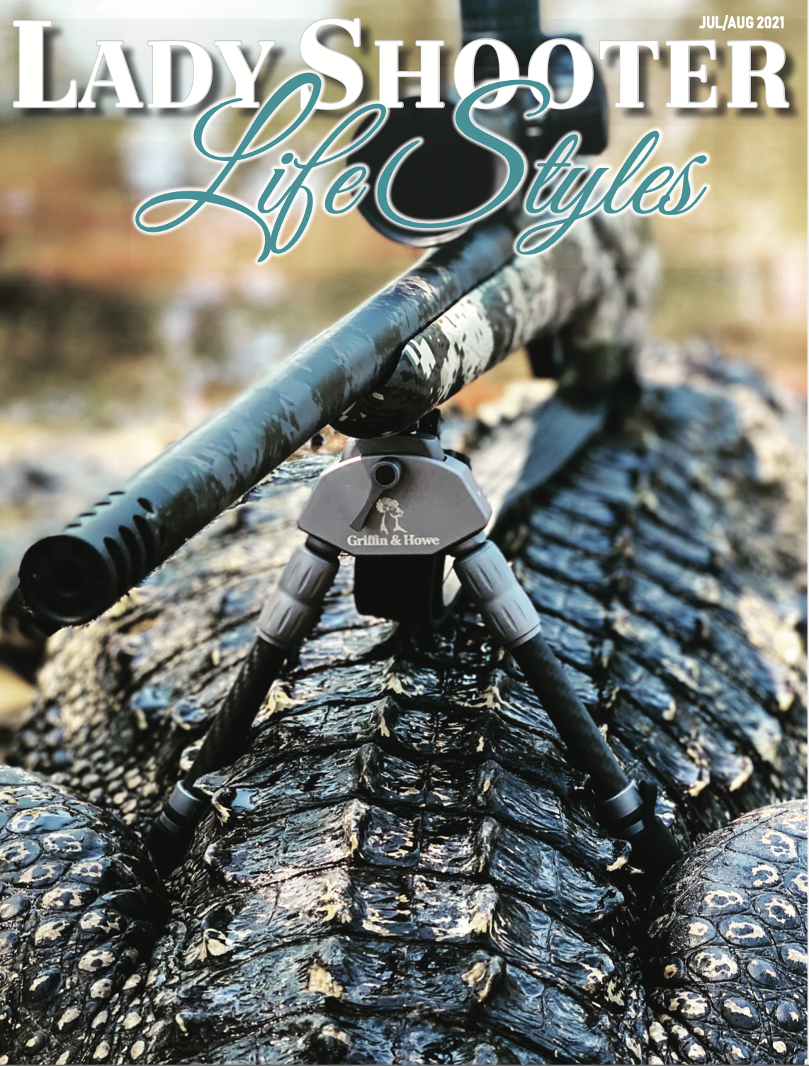 Close-up of an alligator's back with a spotting scope placed on its snout, set outdoors near water. Text on the image reads "Lady Shooter Life Styles" with a release date of July/August 2021.