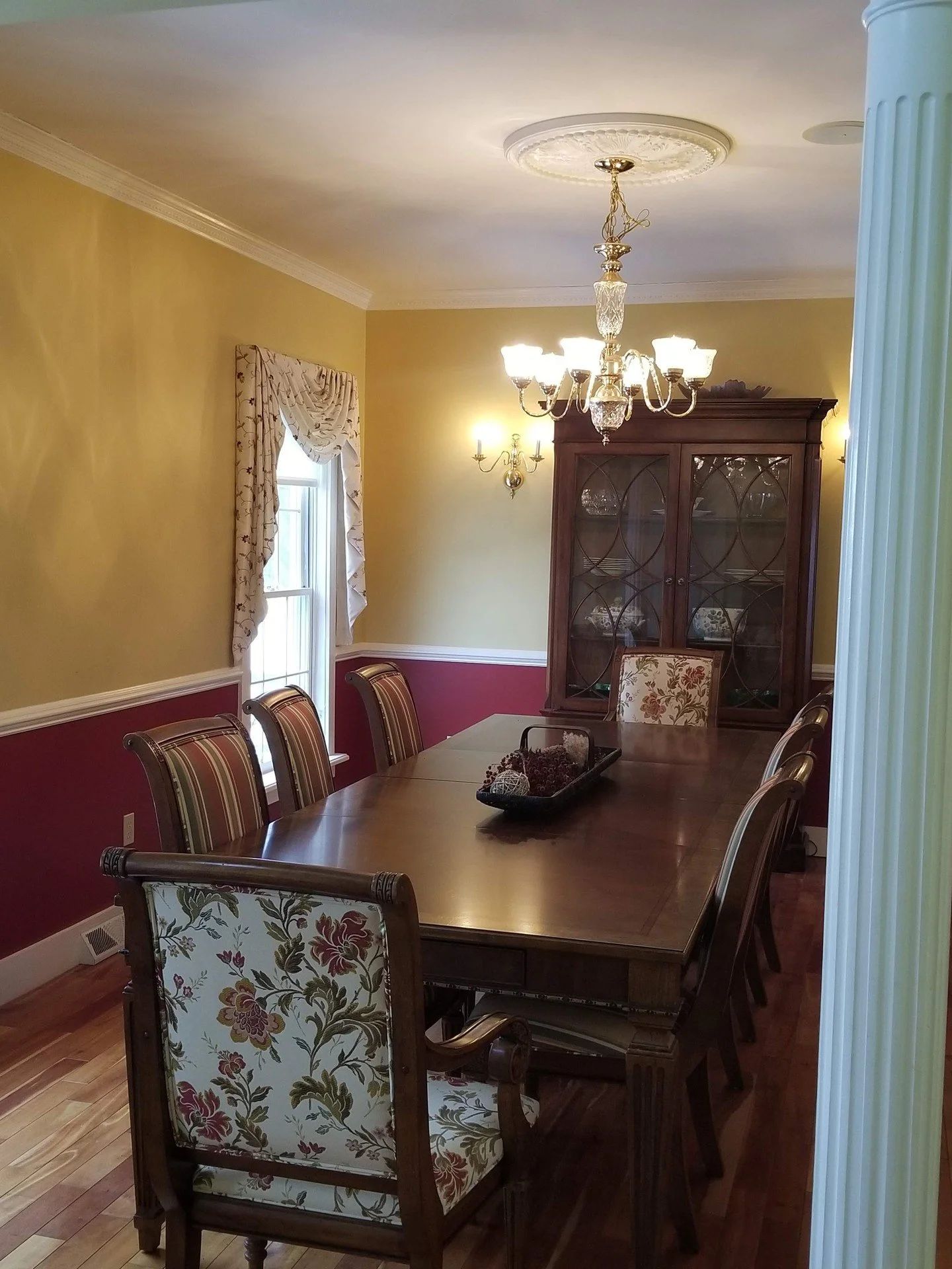 This dining room hadn't changed since 1995. We fixed that.

Gold walls. Burgundy wainscoting. Floral chairs. Brass chandelier. Every 90s cliche in one room &mdash; and a homeowner who had completely stopped using it.

We stripped it back. Warm taupe 