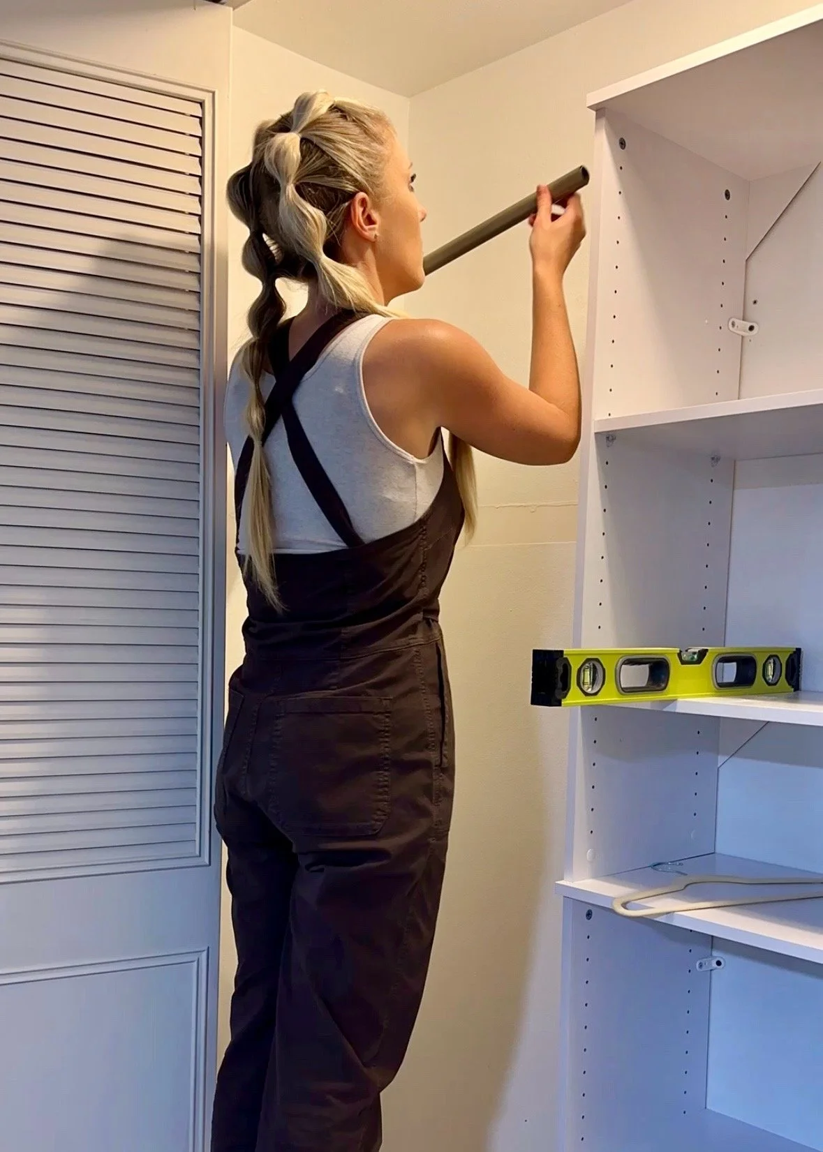 installing closet organizer.jpg