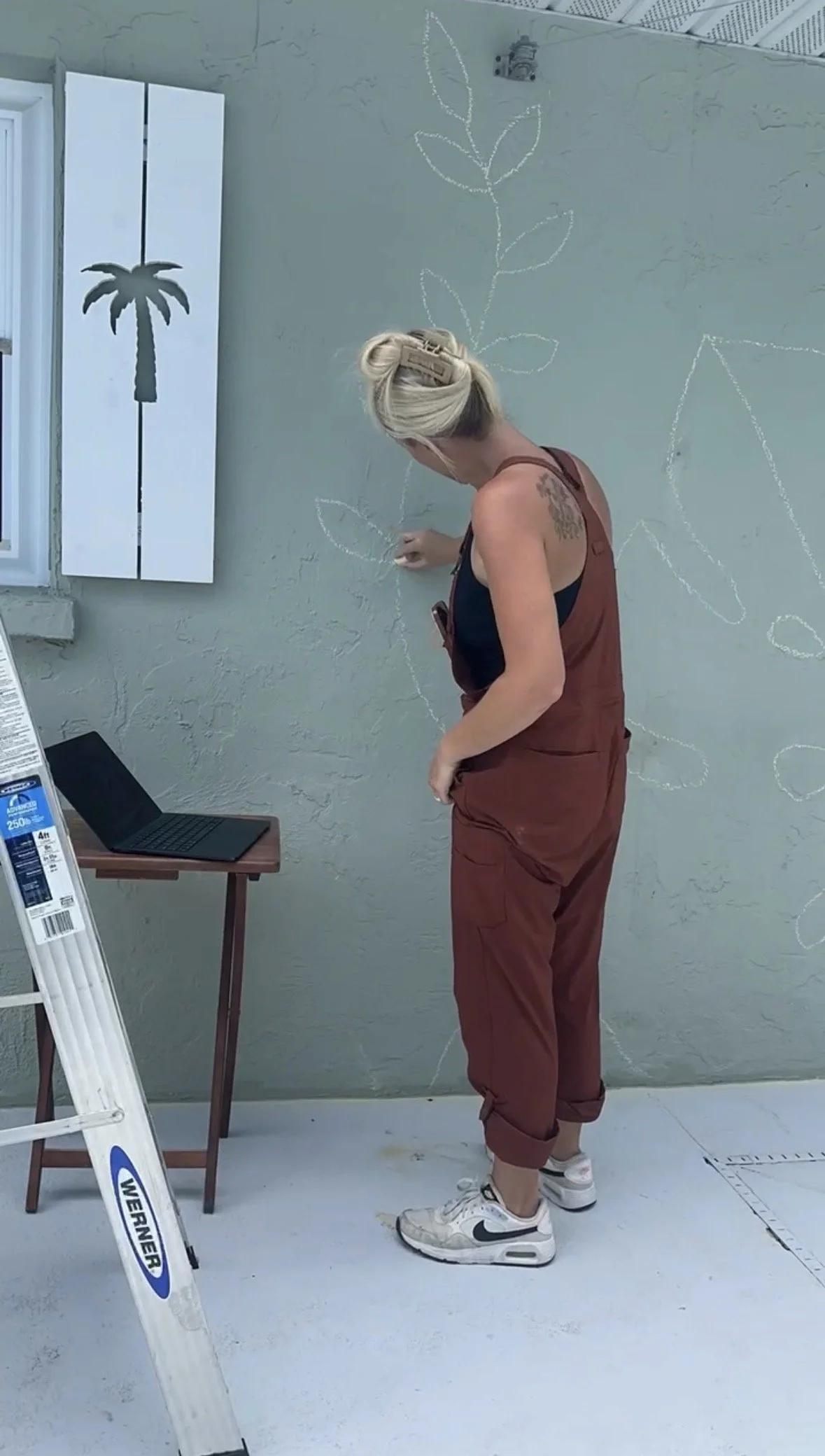 sketching wall mural with chalk.jpg