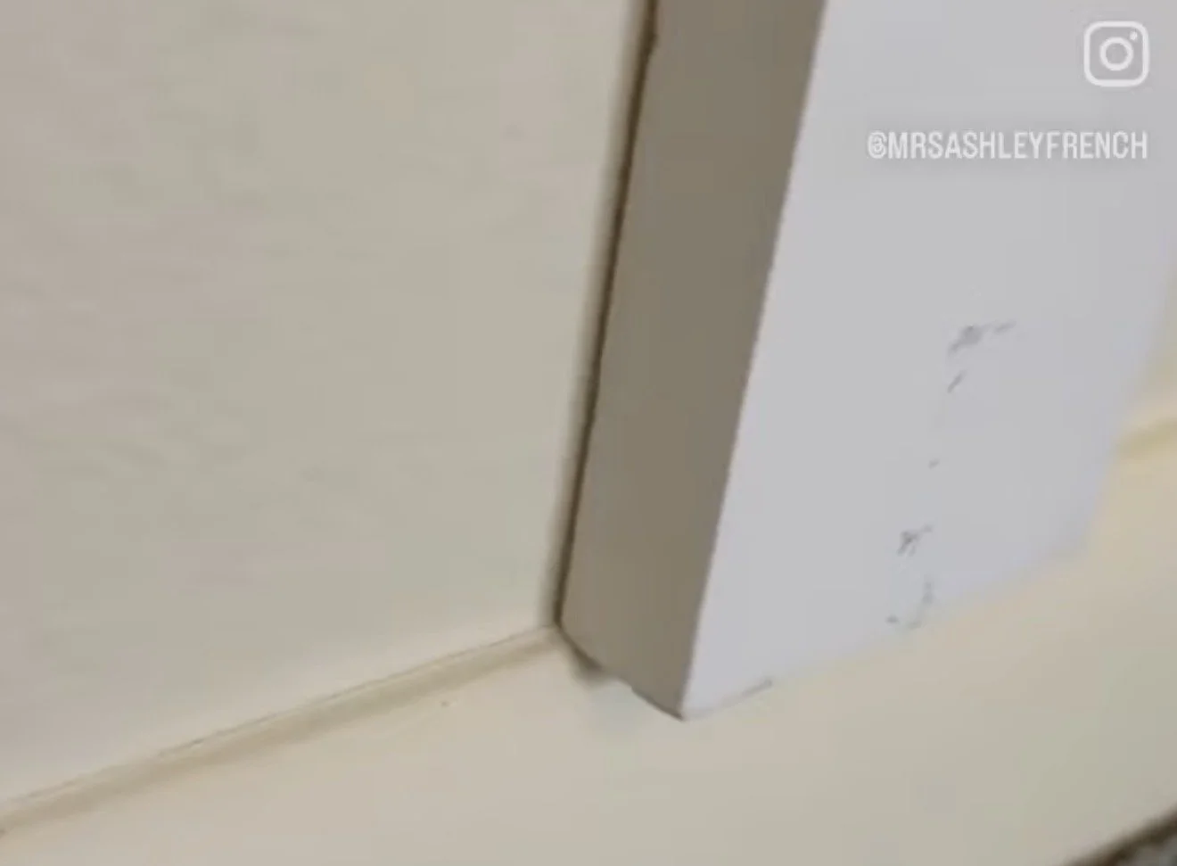 board and batten hanging over baseboards.jpg