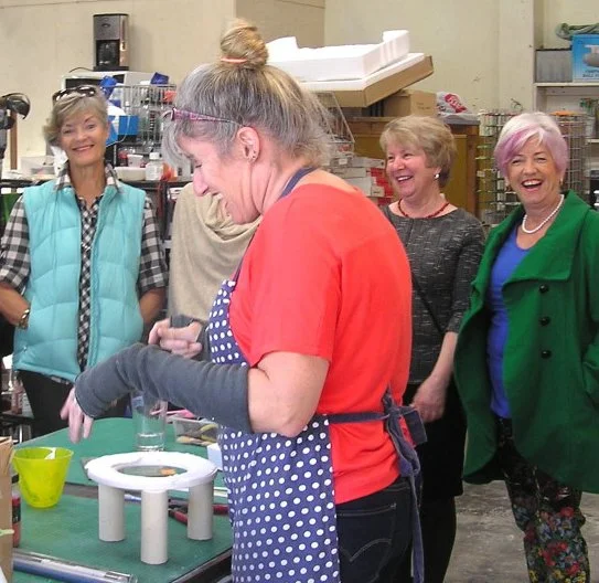 Jo Tricker giving a glass demonstration in her studio.