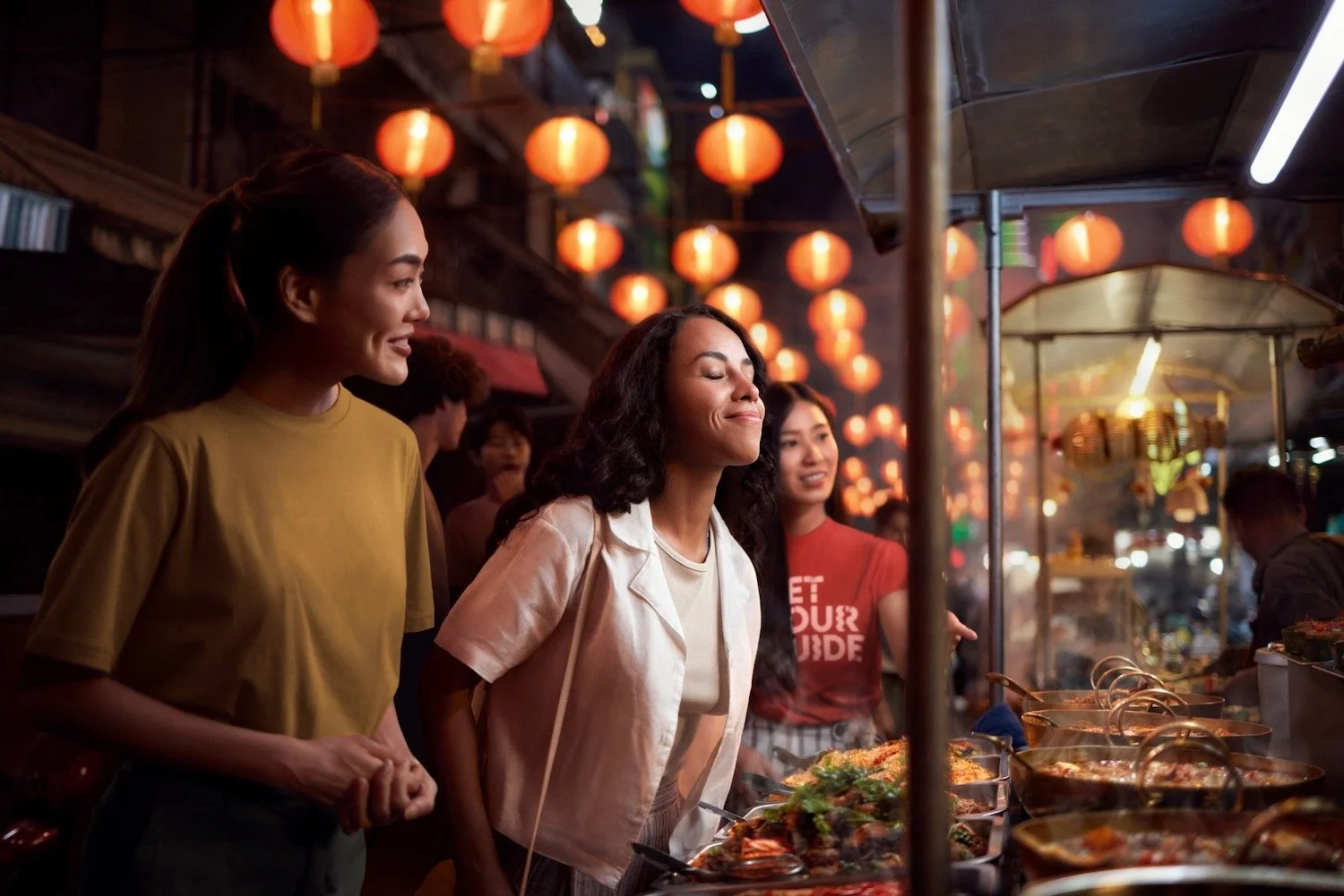 Tourist reacting to spicy street food at a Bangkok Chinatown night market. Make Memories campaign.