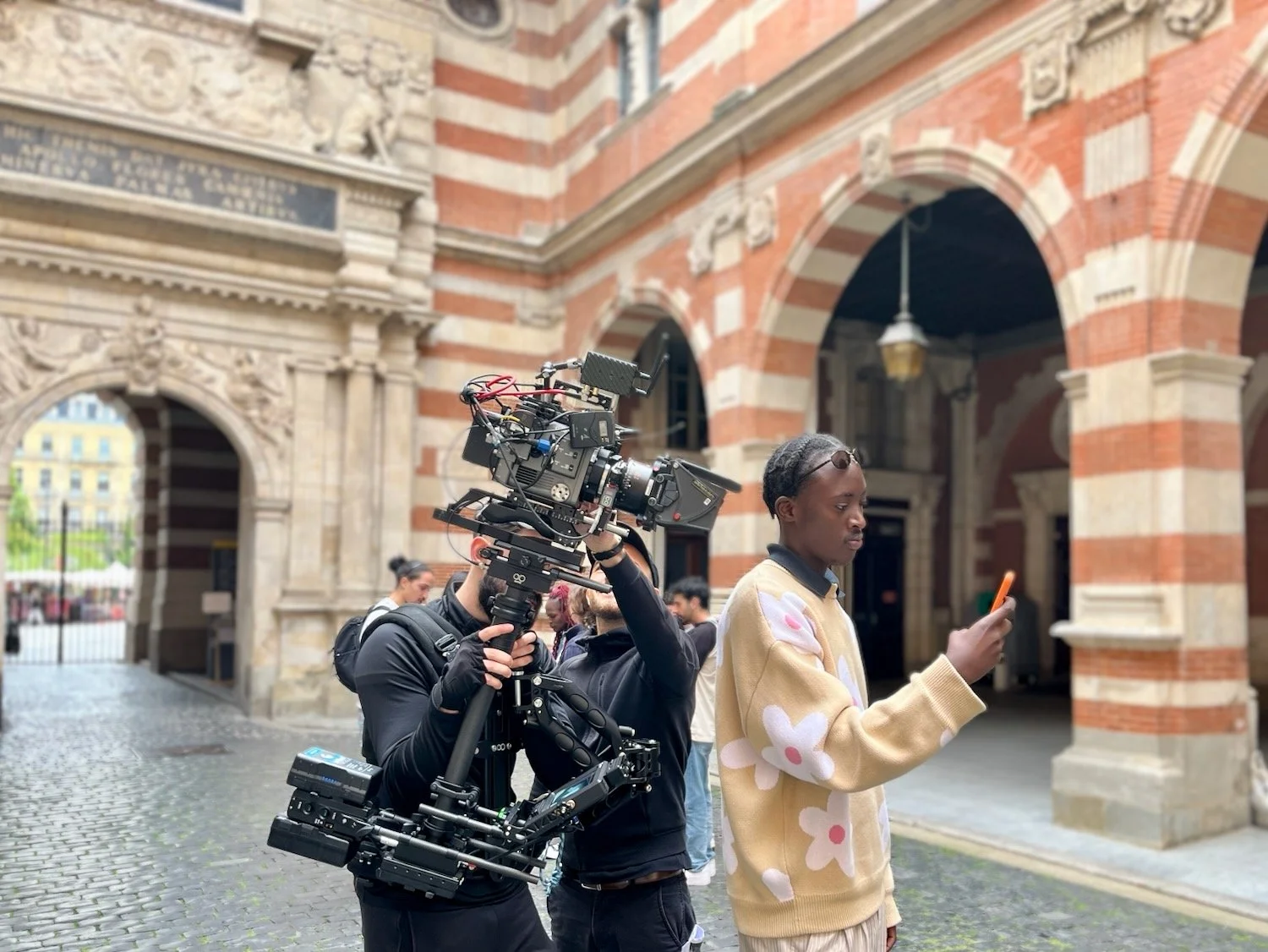 Crew on location, filming phone demos.