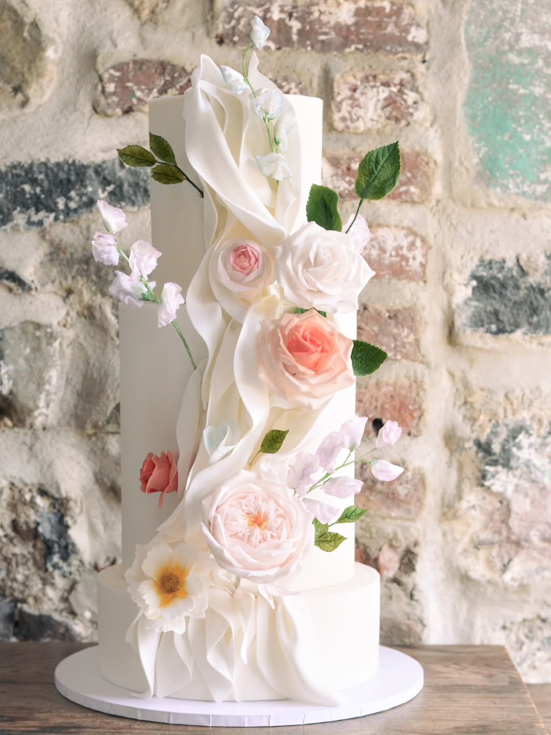 Jane &amp; Scott 

Handmade sugar flowers &amp; ruffled fondant bringing those modern country garden vibes.