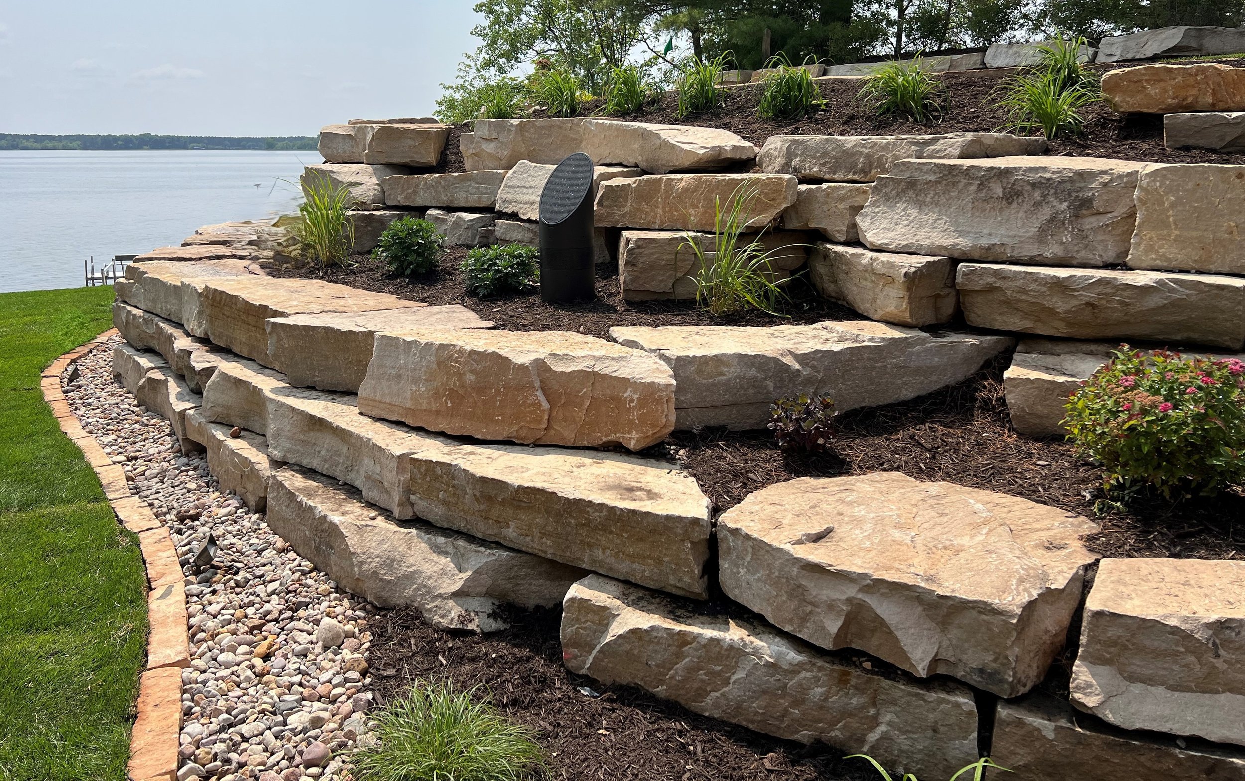 Highland Brown outcropping 8-12" & 10-16", with Sandy Creek lawn edging