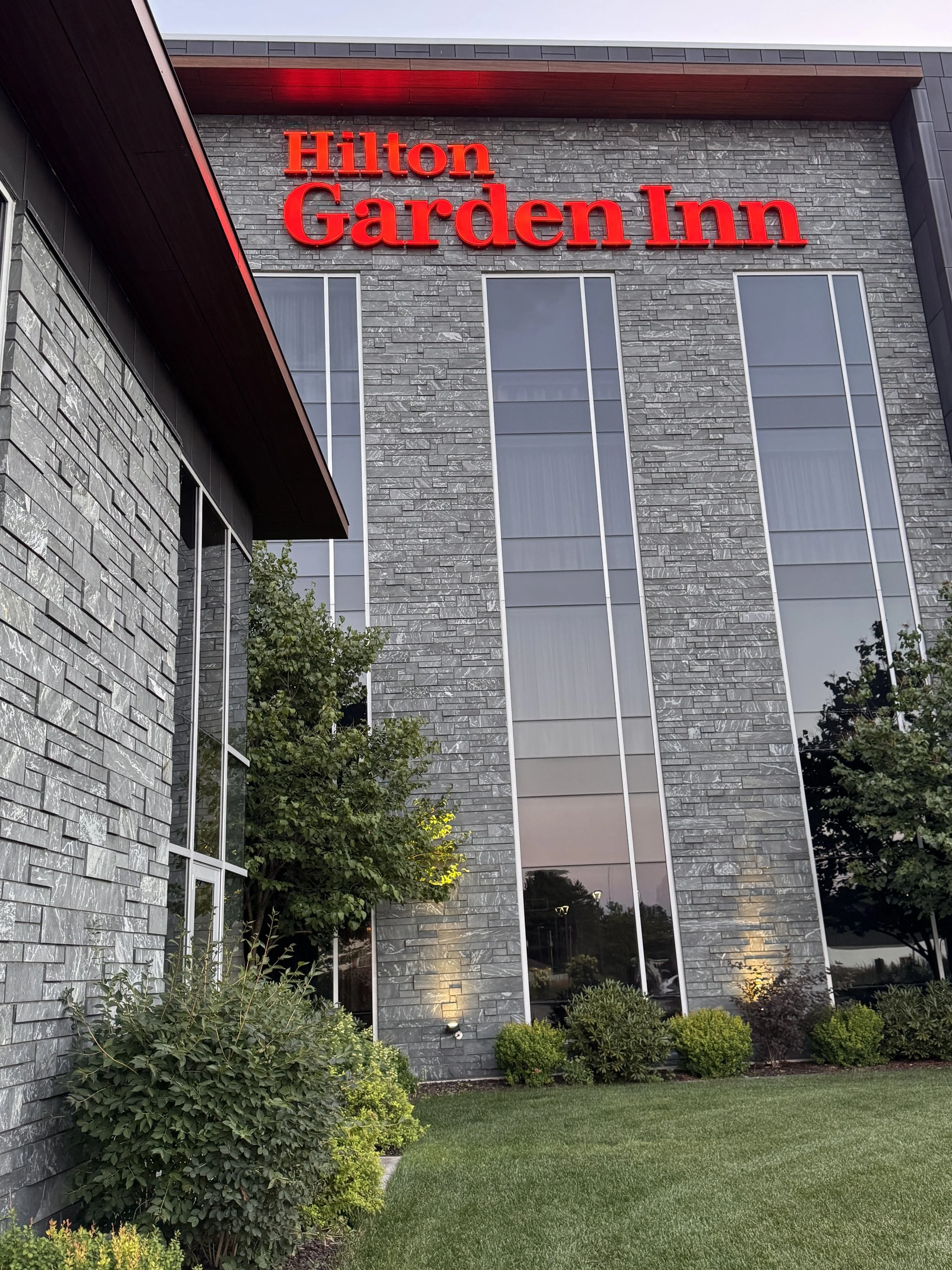 Aqua Grantique sawn height 3 1/2" & 7 1/2" full veneer.  The stone was intentionally set with varying projections to create depth, texture, and visual interest across the façade.