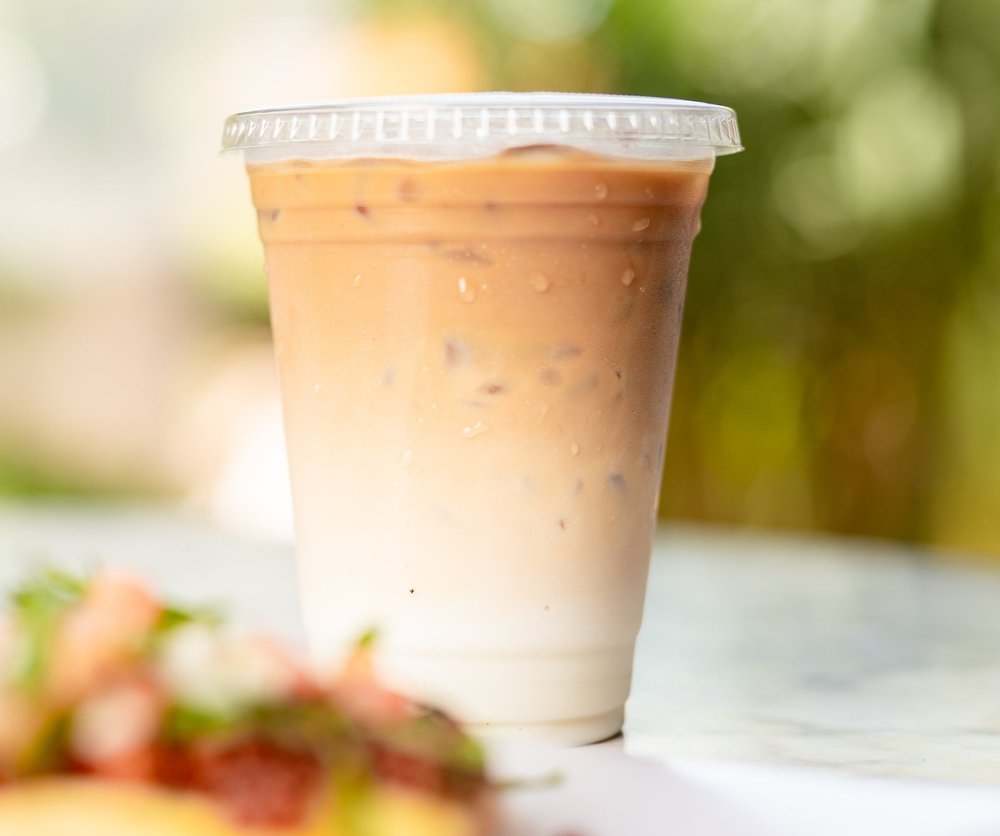 Iced latte coffee in plastic cup 16 oz. Food Images