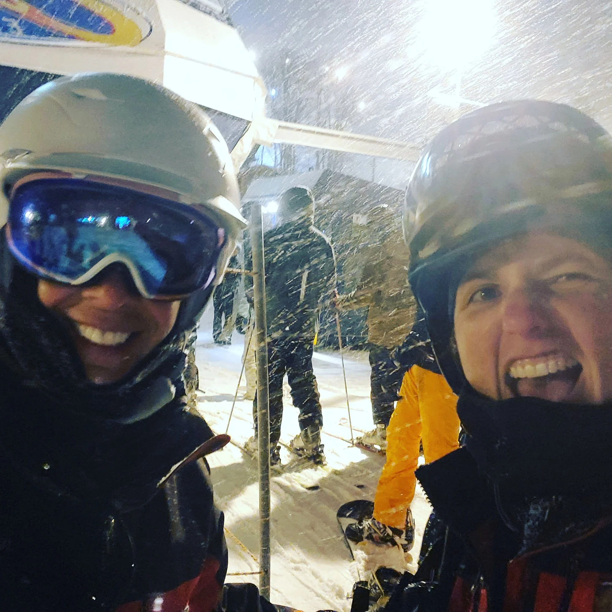 ski patrollers at night
